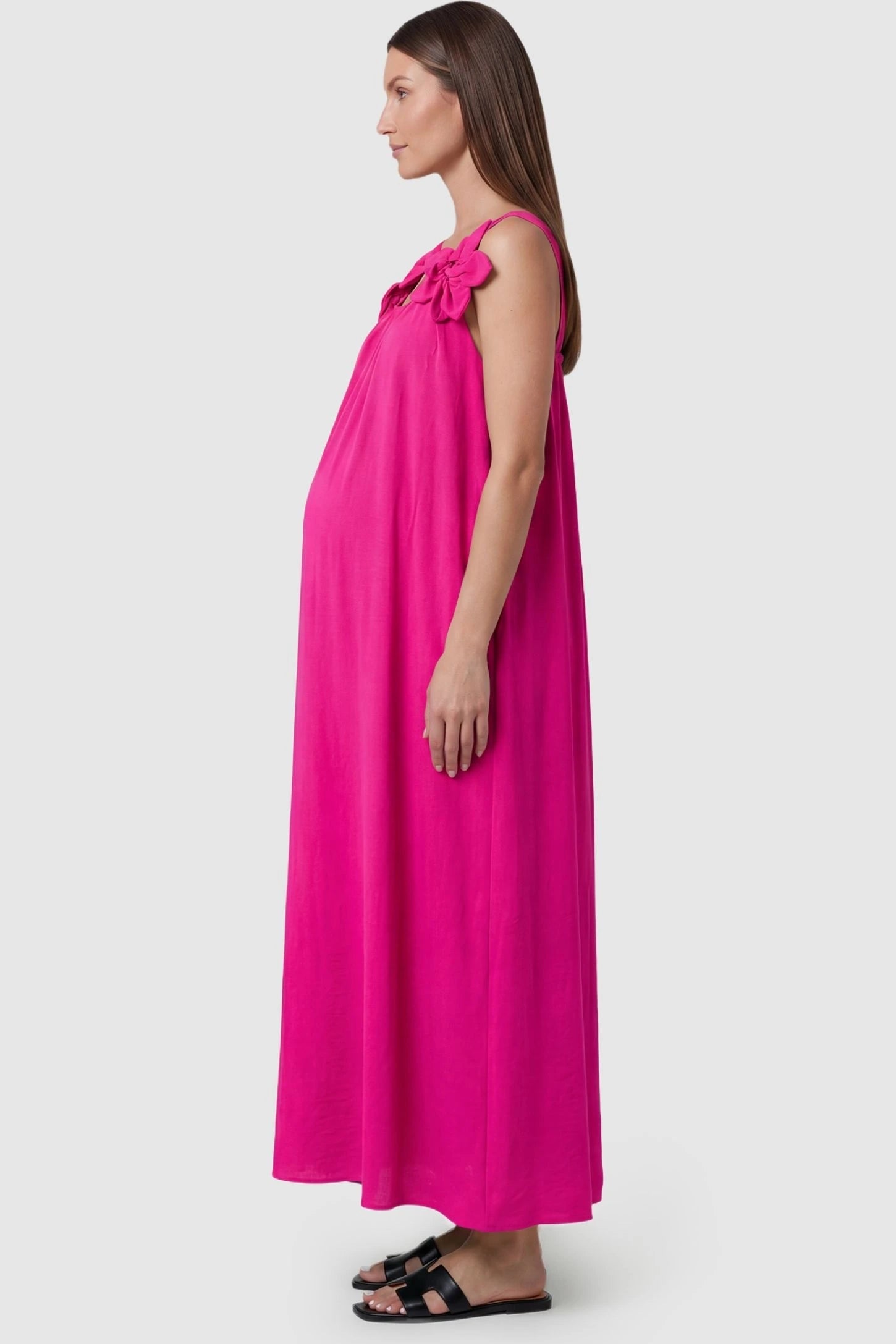 Bow Strap A-Line Maternity Dress Side profile of Pink Bow Strap A-Line Maternity Dress showing the bump-friendly A-line cut on a model.