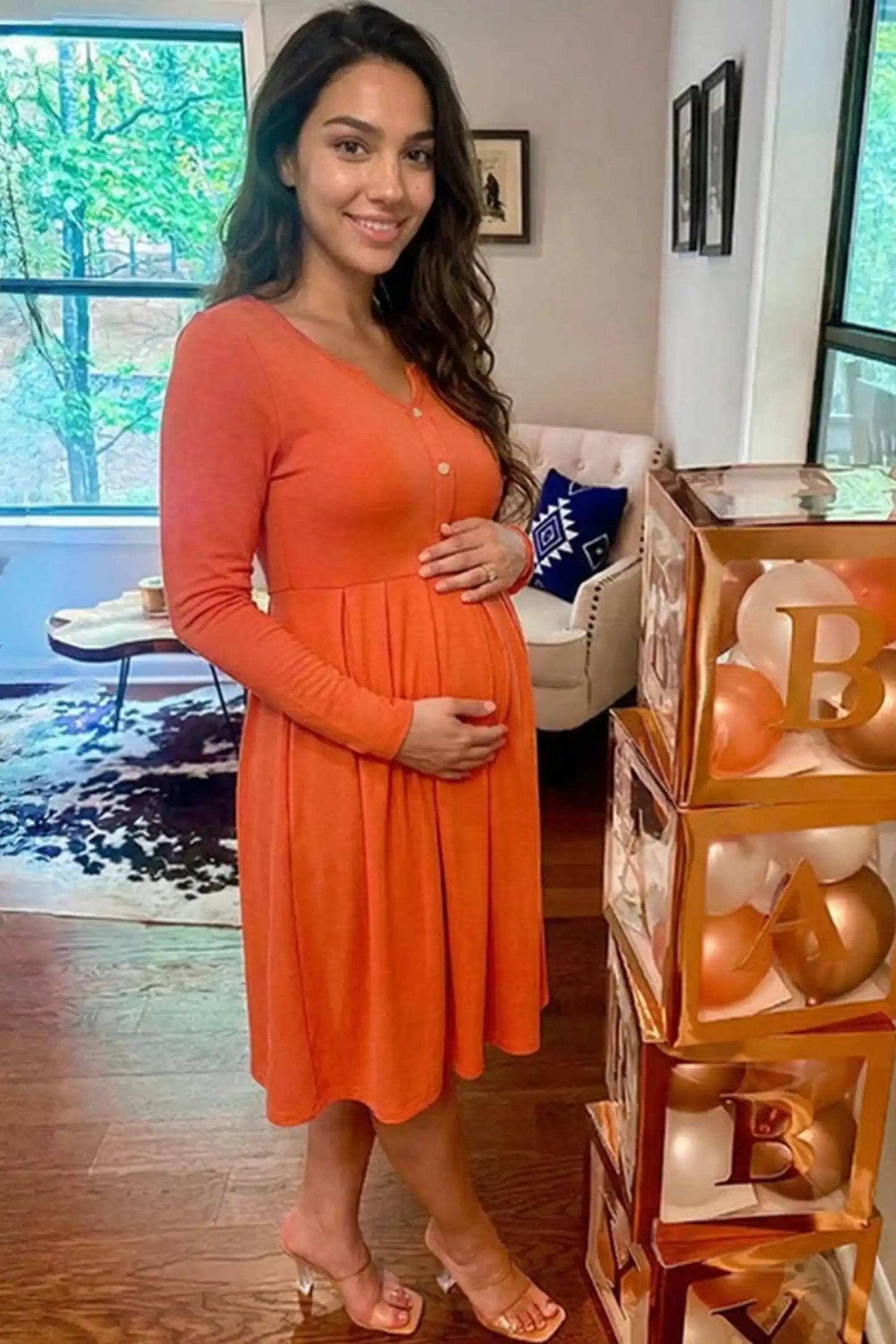 Button Accent Empire Waist Maternity Short Dress Button Accent Pleated Empire Waist Maternity Short Dress in Orange featuring a high-set waist on a pregnant model showing side.