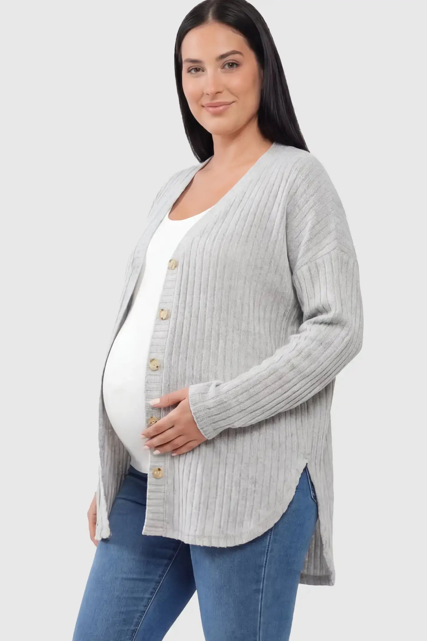 Button Down Ribbed Knit Maternity Cardigan Button Down Ribbed Knit Maternity Cardigan in Light Gray featuring a curved high-low hem on a pregnant model.