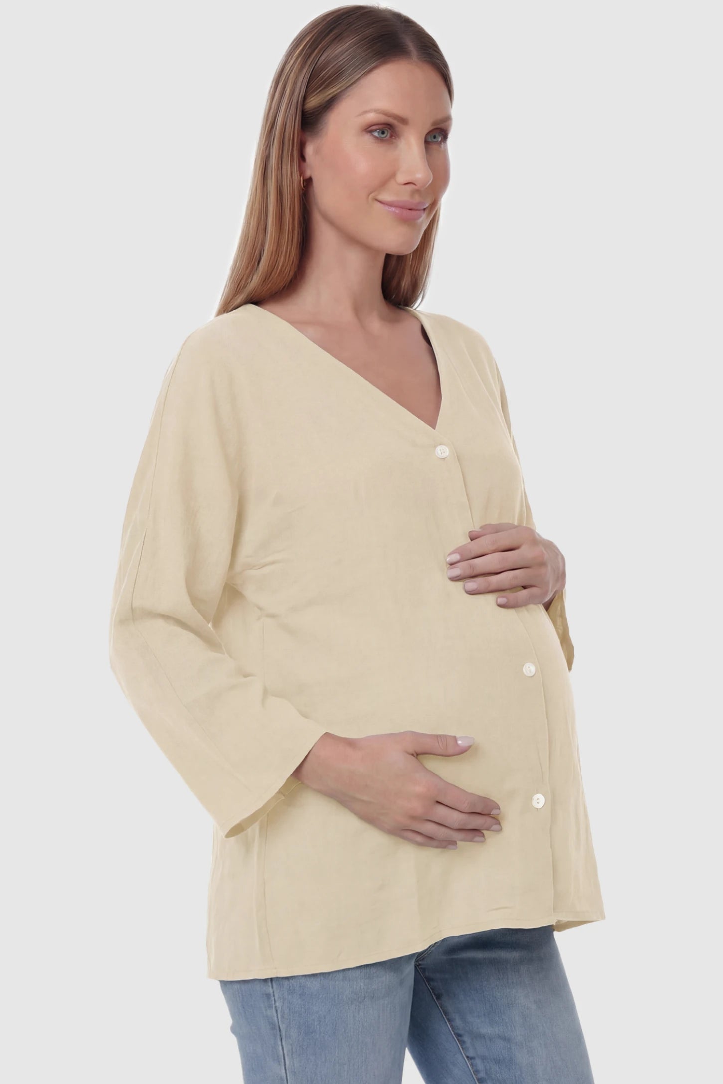 Button Down V-Neck Long Sleeve Maternity Top Button Down V-Neck Long Sleeve Maternity Top in Beige featuring a relaxed drape on a pregnant model, side view.