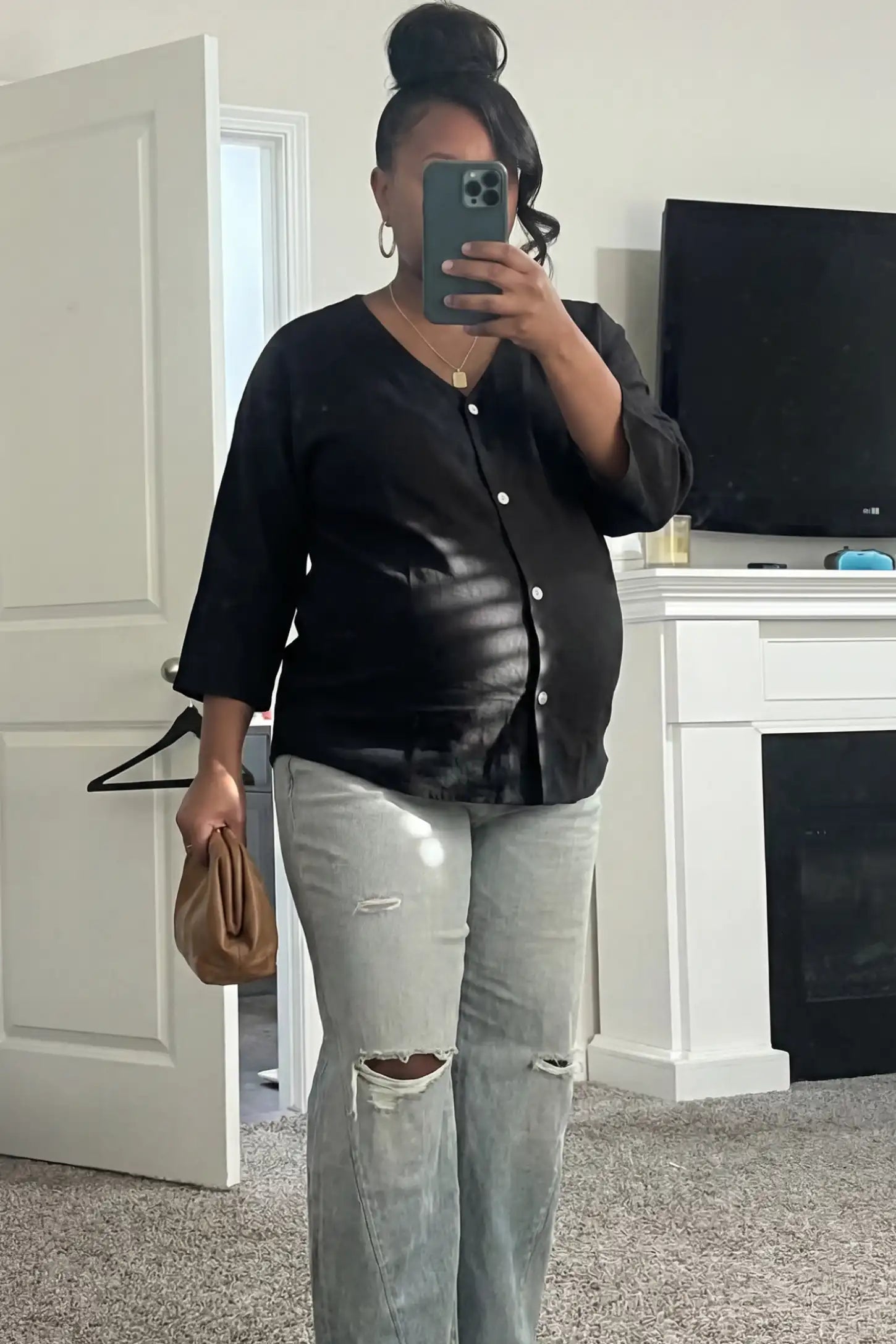 Button Down V-Neck Long Sleeve Maternity Top Button Down V-Neck Long Sleeve Maternity Top in Black featuring a relaxed drape on a pregnant woman, front view.