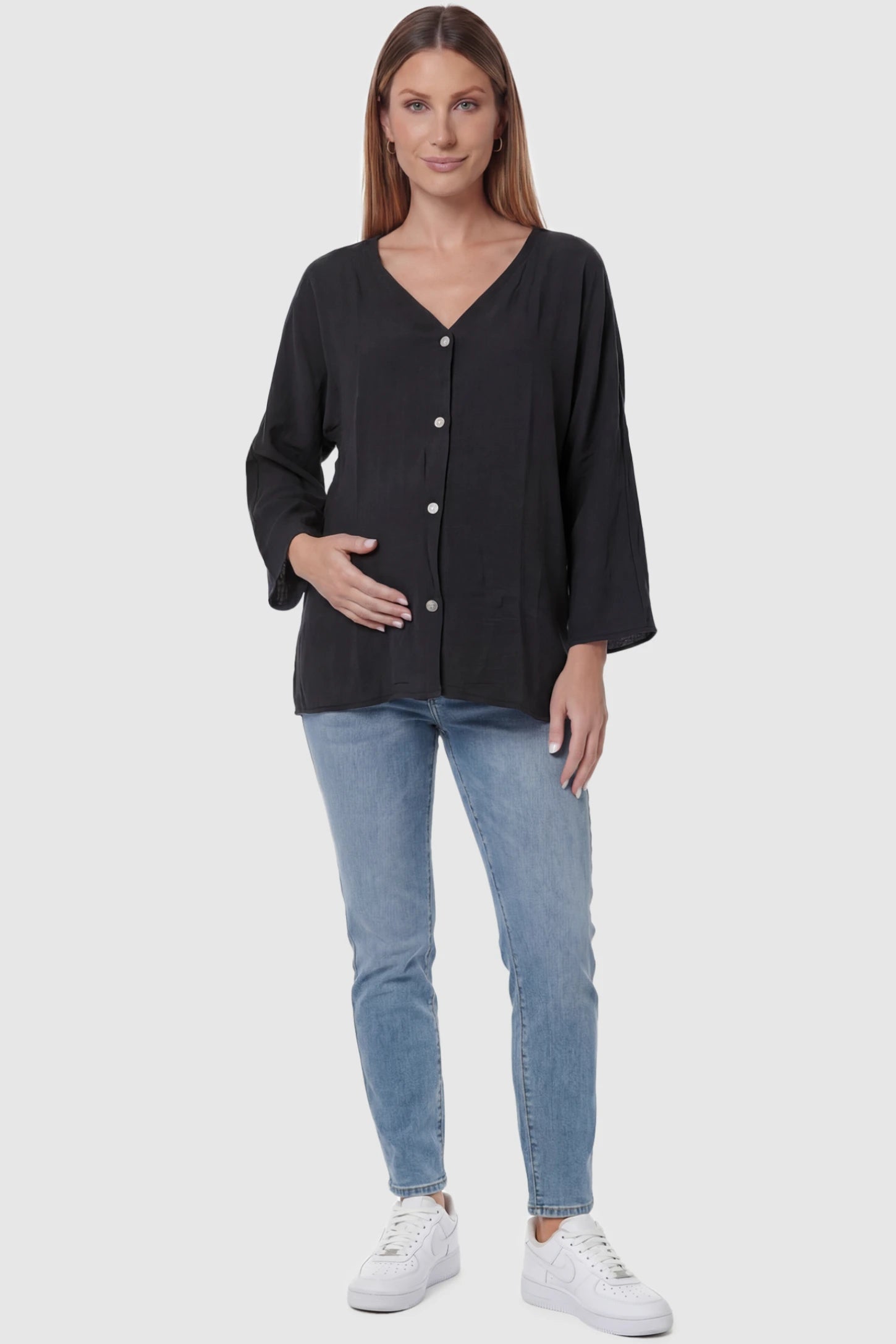 Button Down V-Neck Long Sleeve Maternity Top Button Down V-Neck Long Sleeve Maternity Top in Black featuring a relaxed drape on a pregnant model, full body view.