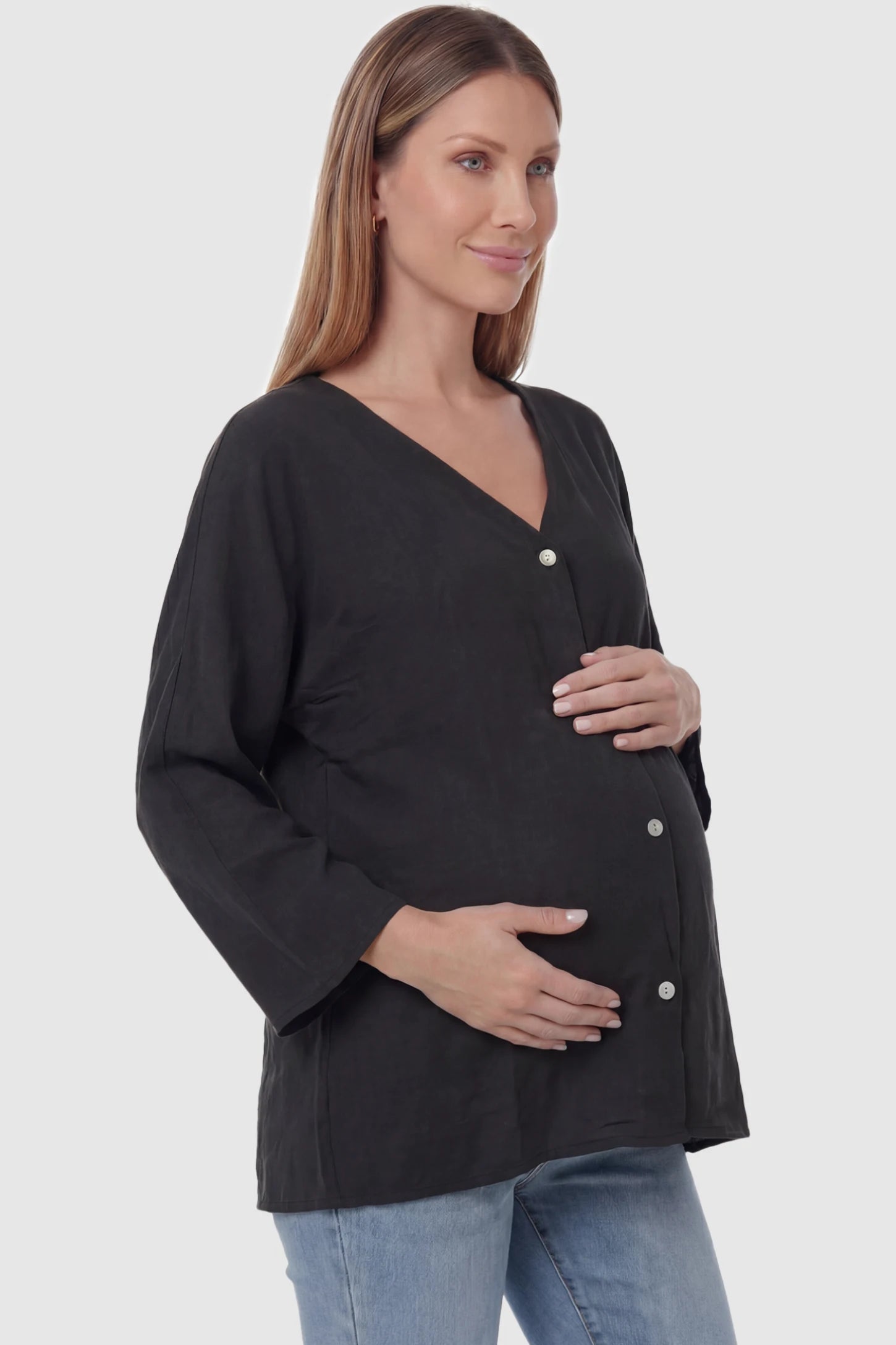 Button Down V-Neck Long Sleeve Maternity Top Button Down V-Neck Long Sleeve Maternity Top in Black featuring a relaxed drape on a pregnant model, side view.