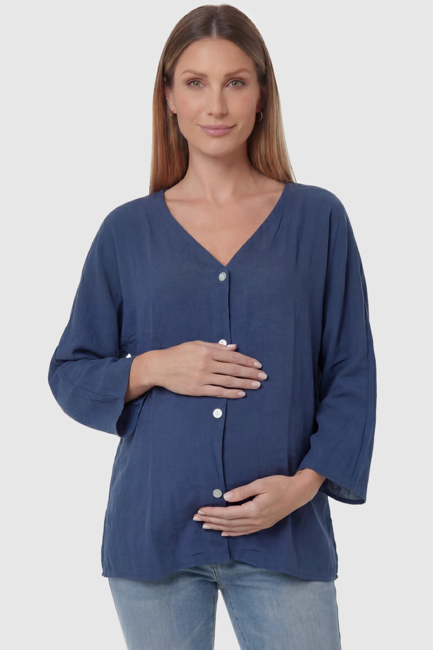 Button Down V-Neck Long Sleeve Maternity Top Button Down V-Neck Long Sleeve Maternity Top in Blue featuring a relaxed drape on a pregnant model, front view.
