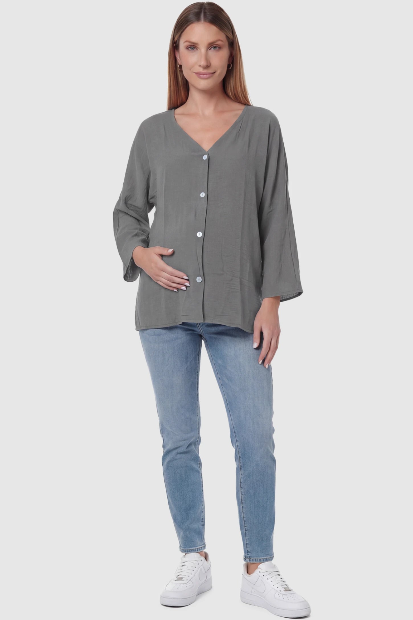 Button Down V-Neck Long Sleeve Maternity Top Button Down V-Neck Long Sleeve Maternity Top in Gray featuring a relaxed drape on a pregnant model, full body view.