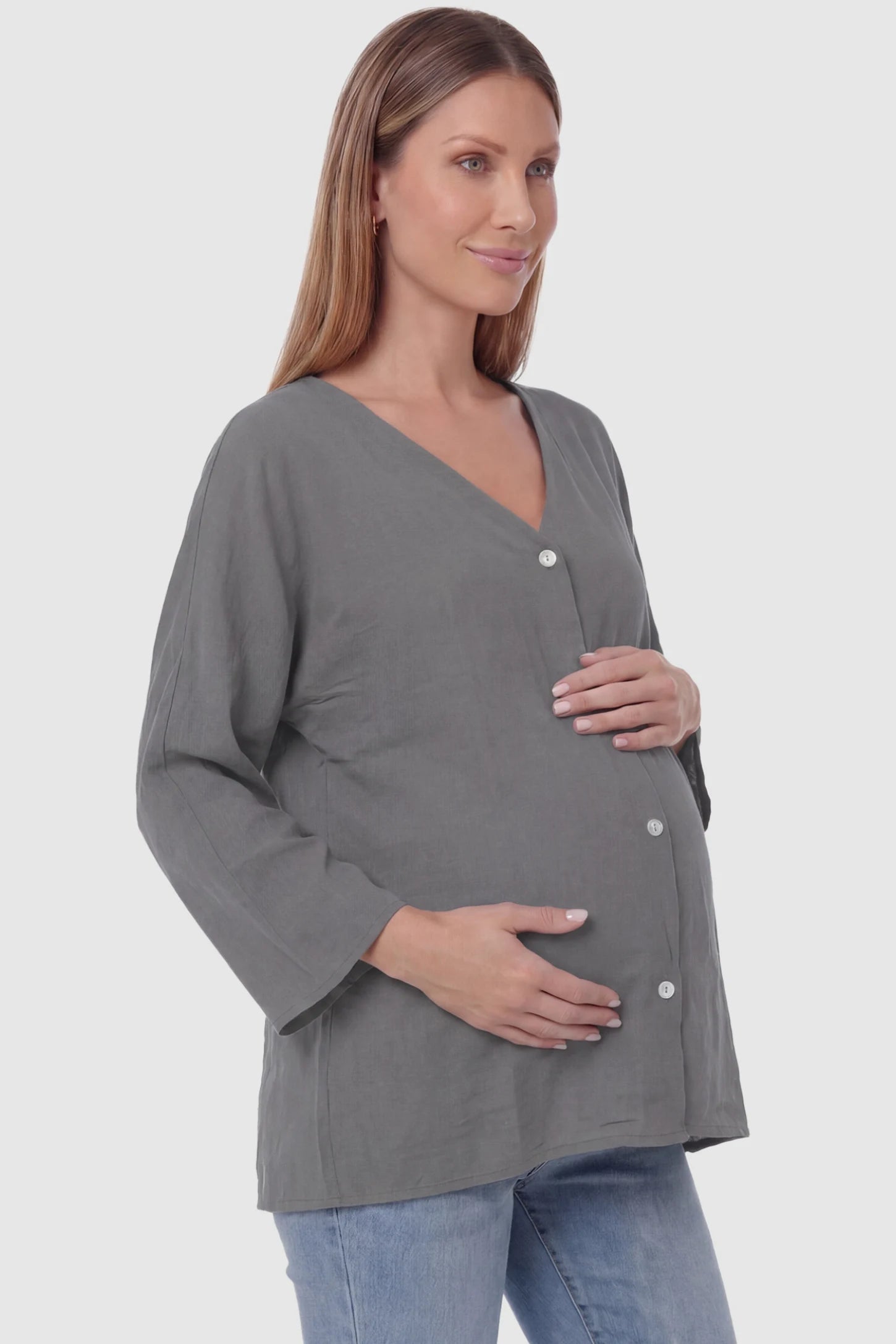 Button Down V-Neck Long Sleeve Maternity Top Button Down V-Neck Long Sleeve Maternity Top in Gray featuring a relaxed drape on a pregnant model, side view.