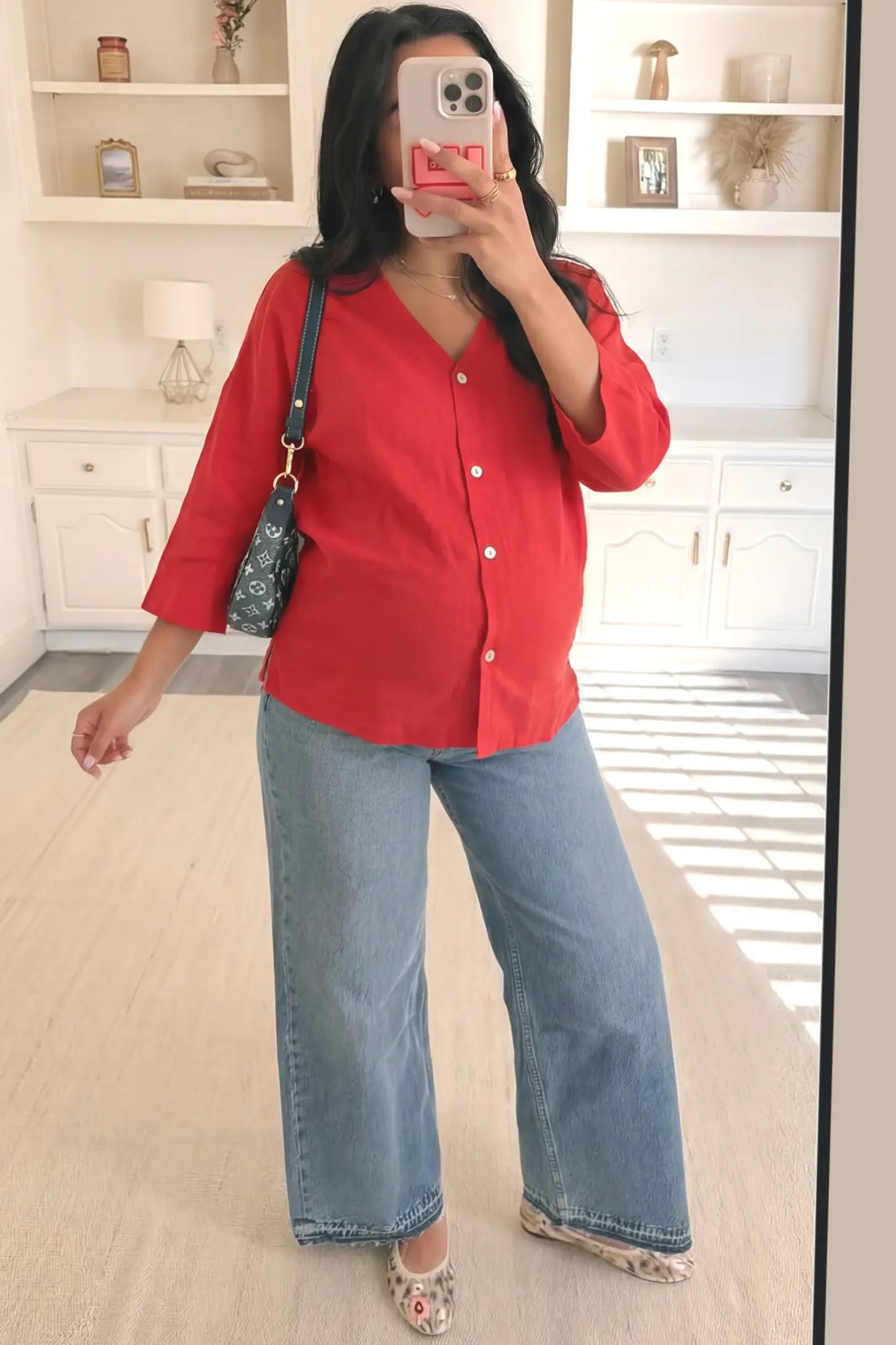 Button Down V-Neck Long Sleeve Maternity Top Button Down V-Neck Long Sleeve Maternity Top in Red featuring a relaxed drape on a pregnant woman, front view.
