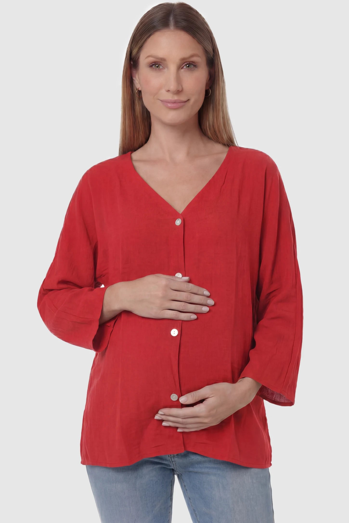 Button Down V-Neck Long Sleeve Maternity Top Button Down V-Neck Long Sleeve Maternity Top in Red featuring a relaxed drape on a pregnant model, front view.