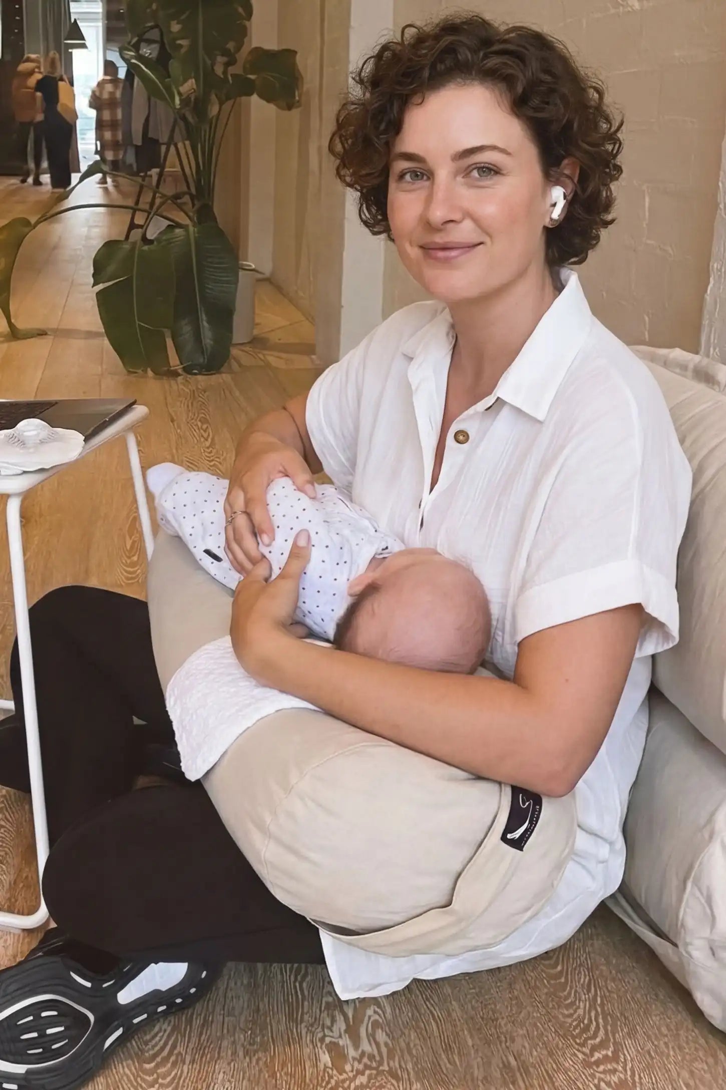 Breezy Button-Front Collared Nursing Dress White Breezy Button-Front Collared Nursing Dress featuring easy breastfeeding access on a postpartum mom.