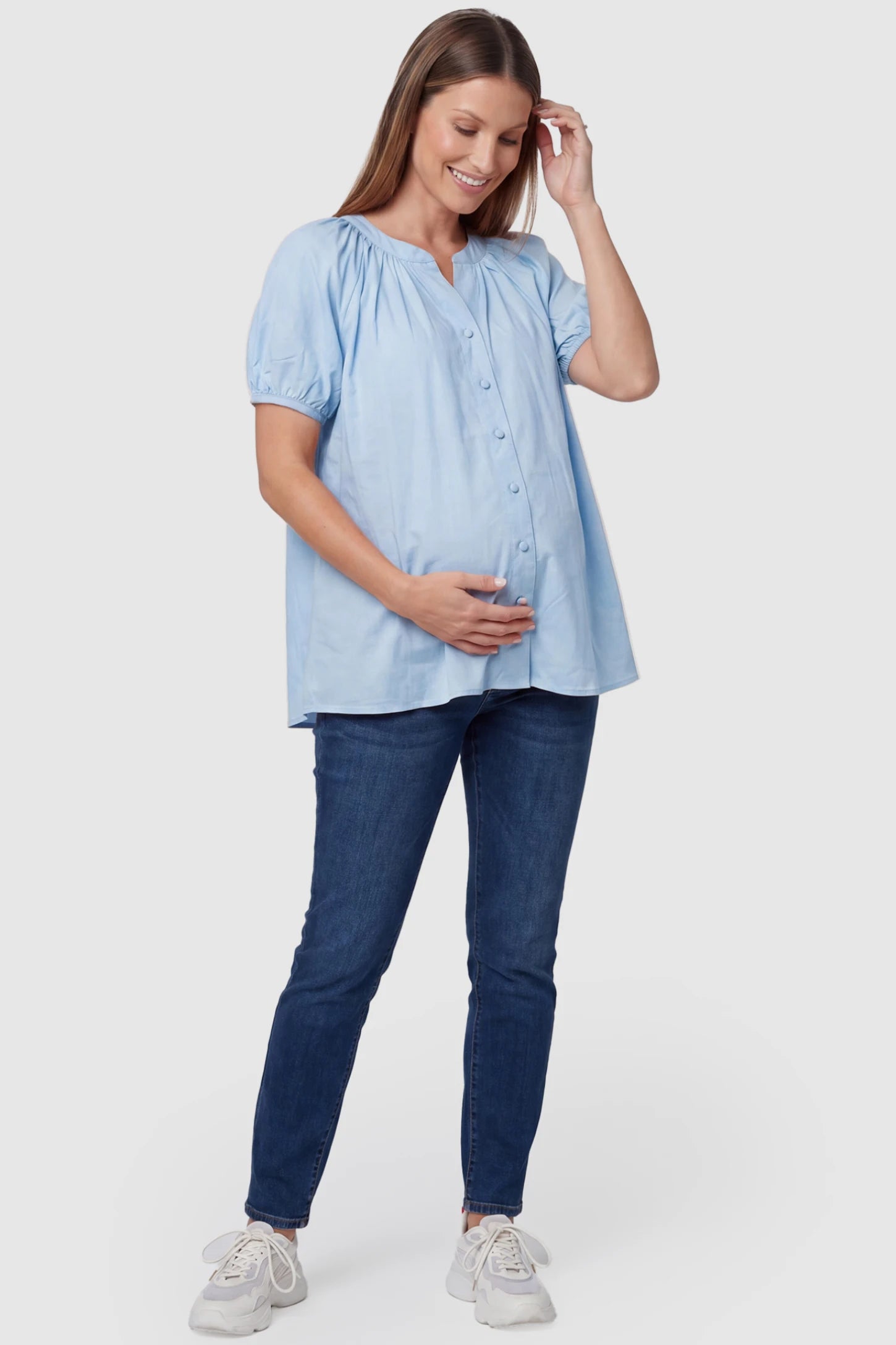 Button Front Short Sleeve Maternity Blouse Button Front Short Sleeve Maternity Blouse in Blue featuring gathered fabric and a button-up neck on a pregnant model, full body view.