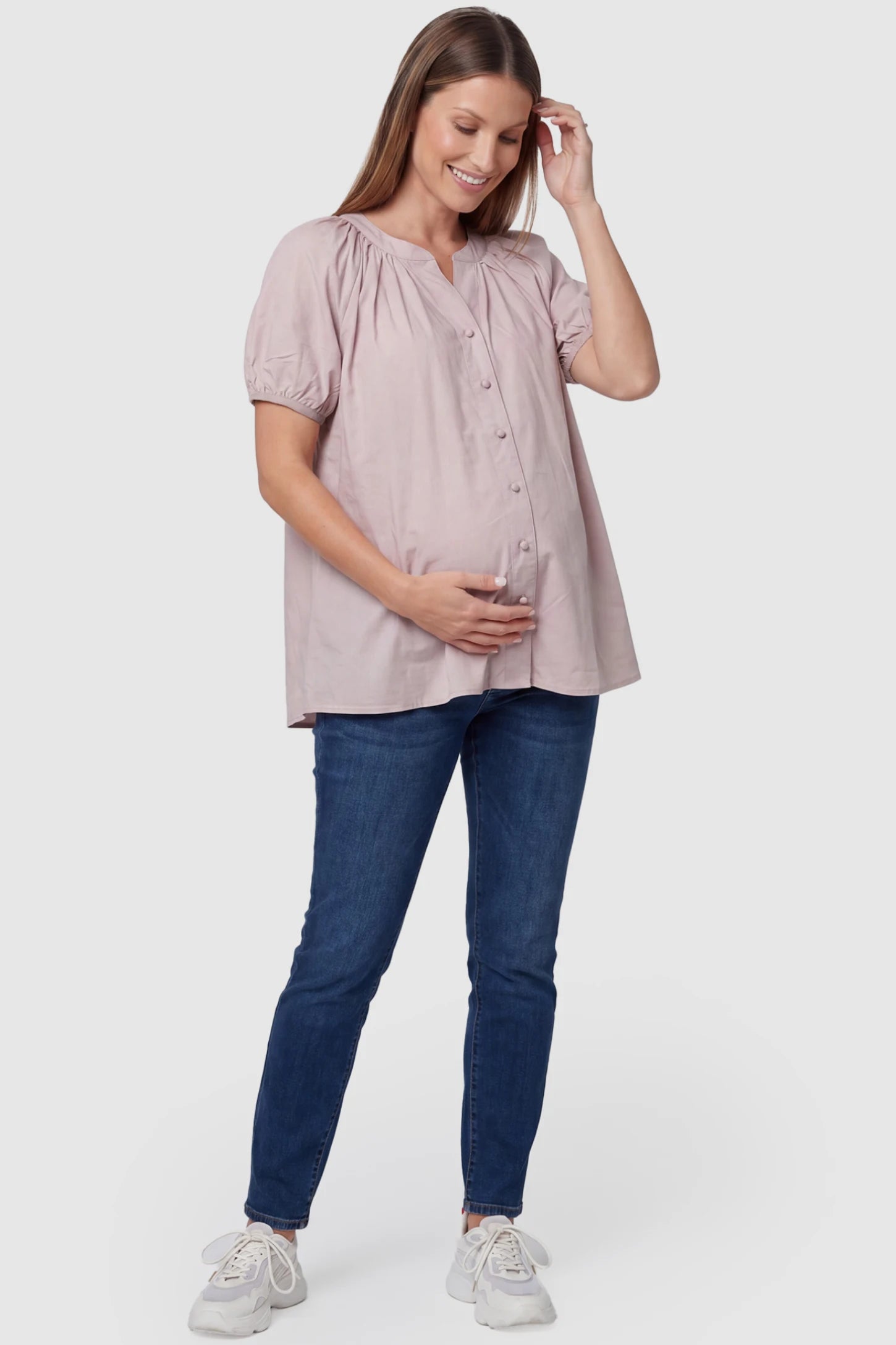 Button Front Short Sleeve Maternity Blouse Button Front Short Sleeve Maternity Blouse in Pink featuring gathered fabric and a button-up neck on a pregnant model, full body view.