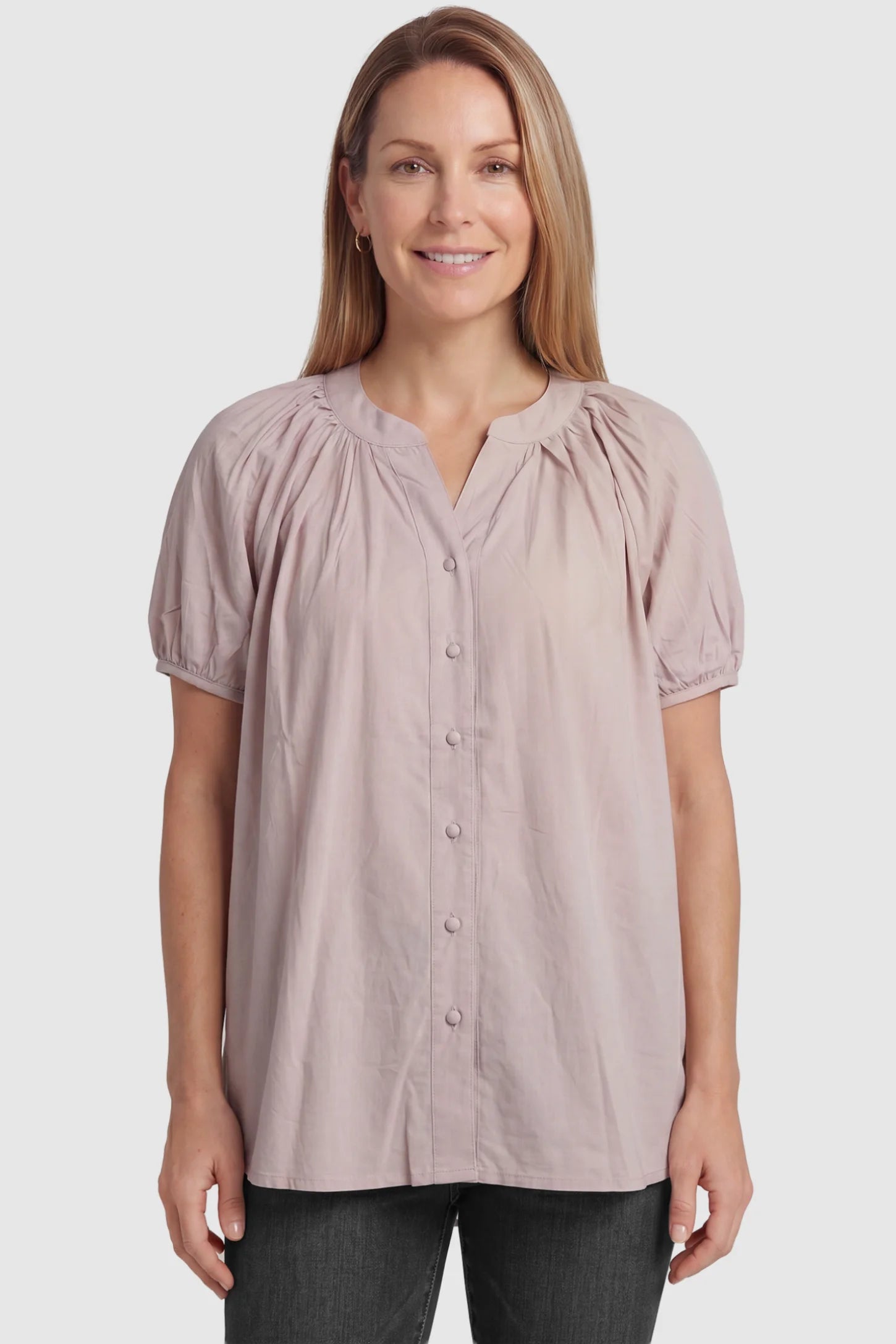 Button Front Short Sleeve Maternity Blouse Button Front Short Sleeve Maternity Blouse in Pink featuring gathered fabric and a button-up neck on a postpartum model, front view.