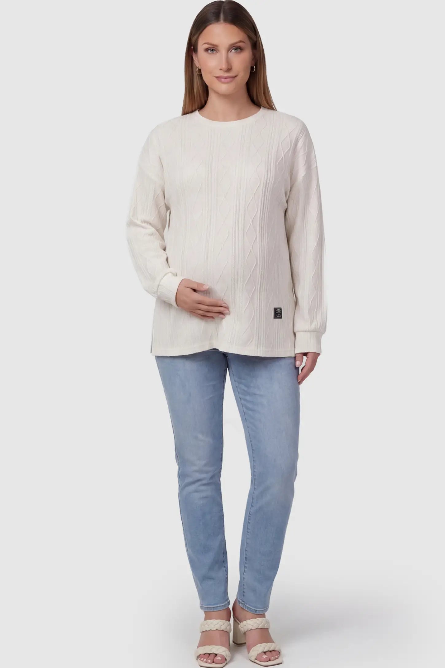 Cable Knit Long Sleeve Maternity Sweater Cable Knit Long Sleeve Maternity Sweater in Apricot on a pregnant model.