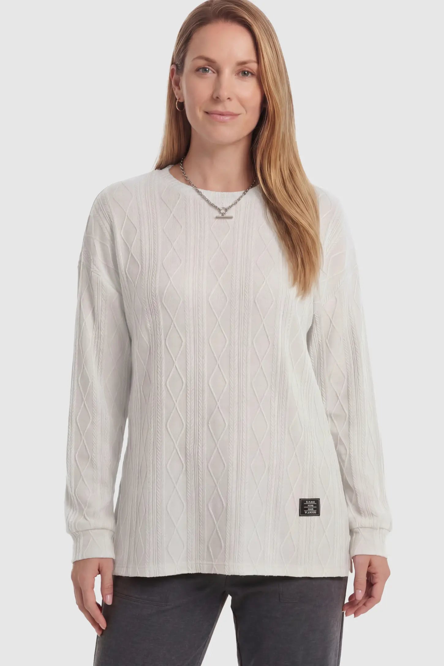 Cable Knit Long Sleeve Maternity Sweater Cable Knit Long Sleeve Maternity Sweater in Apricot on a non pregnant model.