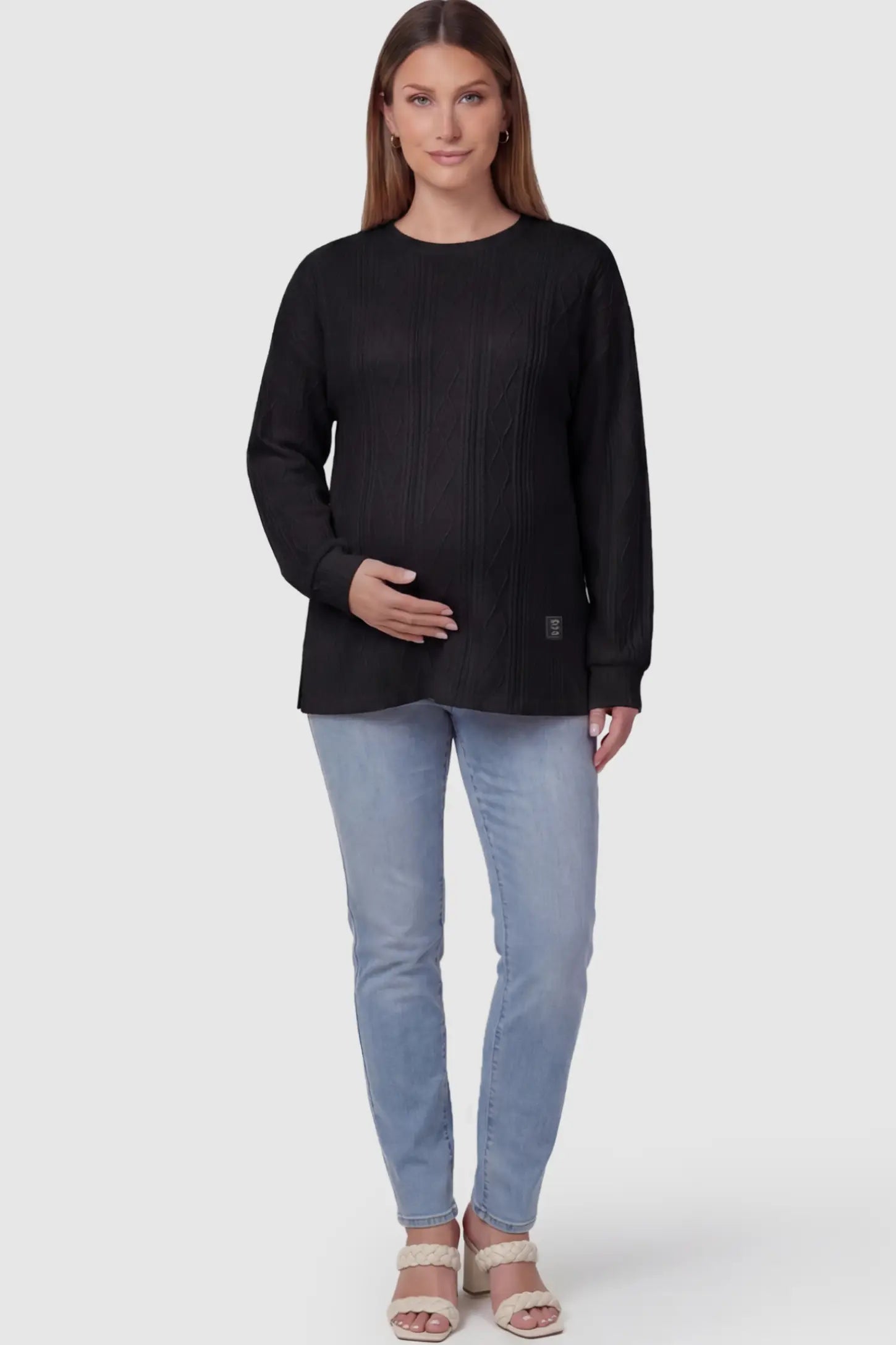 Cable Knit Long Sleeve Maternity Sweater Cable Knit Long Sleeve Maternity Sweater in black on a pregnant model.
