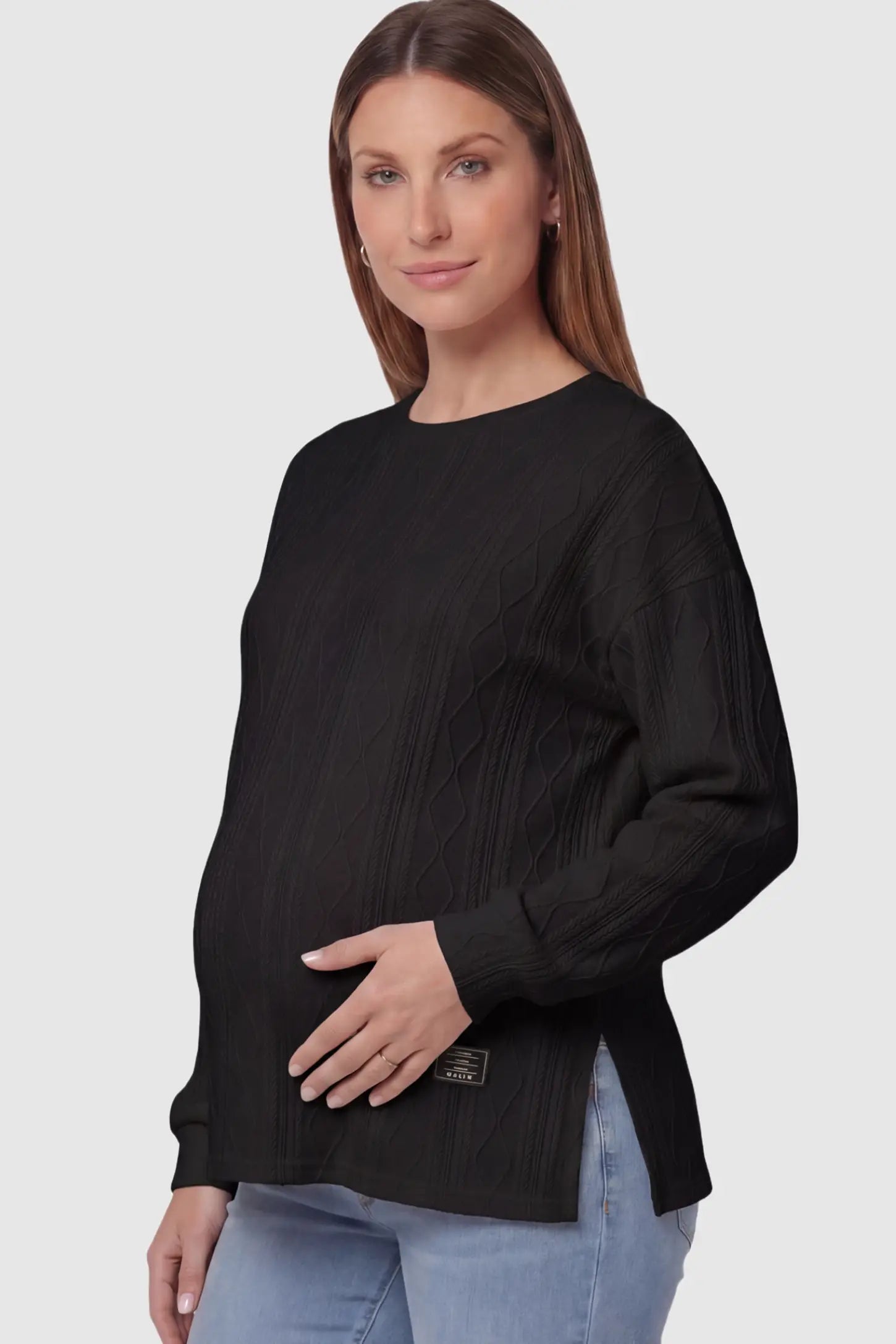 Cable Knit Long Sleeve Maternity Sweater Cable Knit Long Sleeve Maternity Sweater in black on a pregnant model.