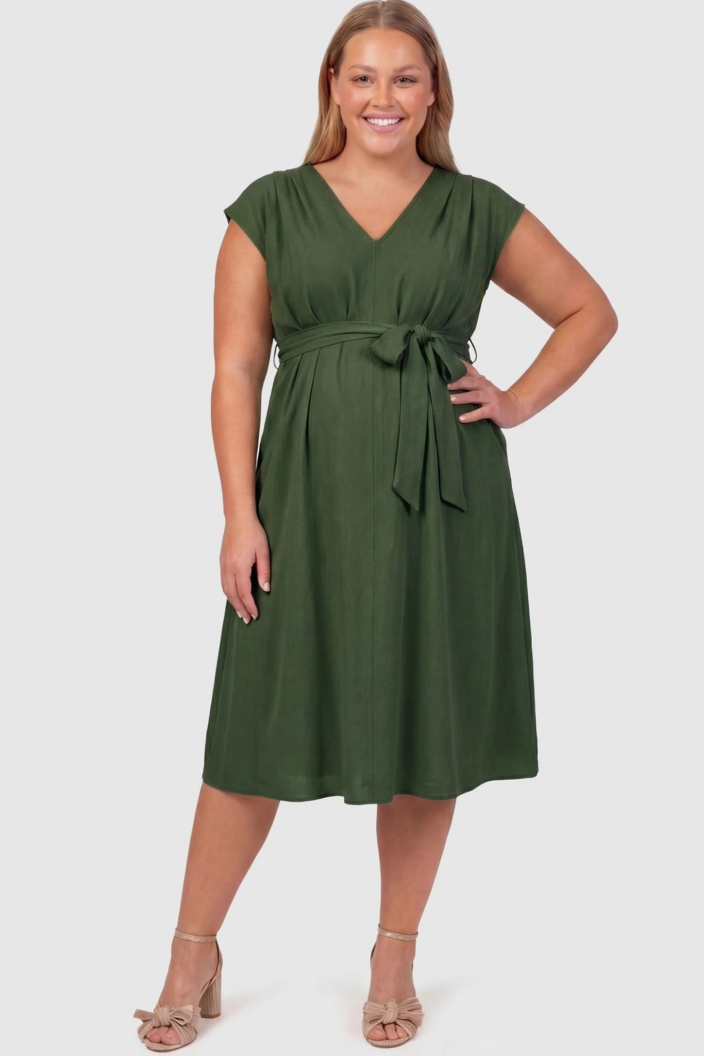 Cap Sleeves Belted Maternity Midi Dress Cap Sleeves Belted Midi Dress in Army Green featuring a tie waist on a plus-size pregnant model, front view.