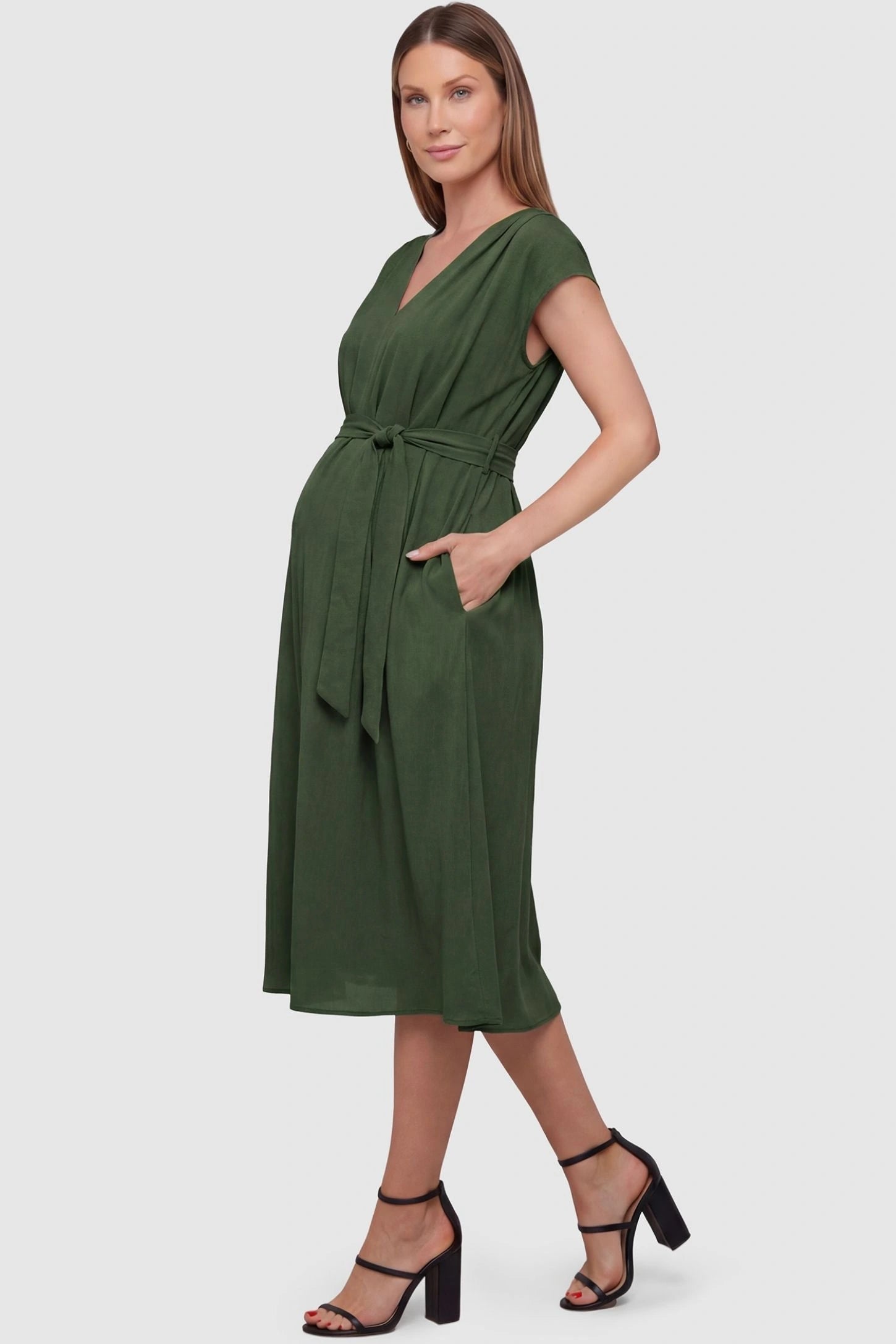 Cap Sleeves Belted Maternity Midi Dress Cap Sleeves Belted Midi Dress in Army Green featuring a tie waist on a pregnant model, side view.