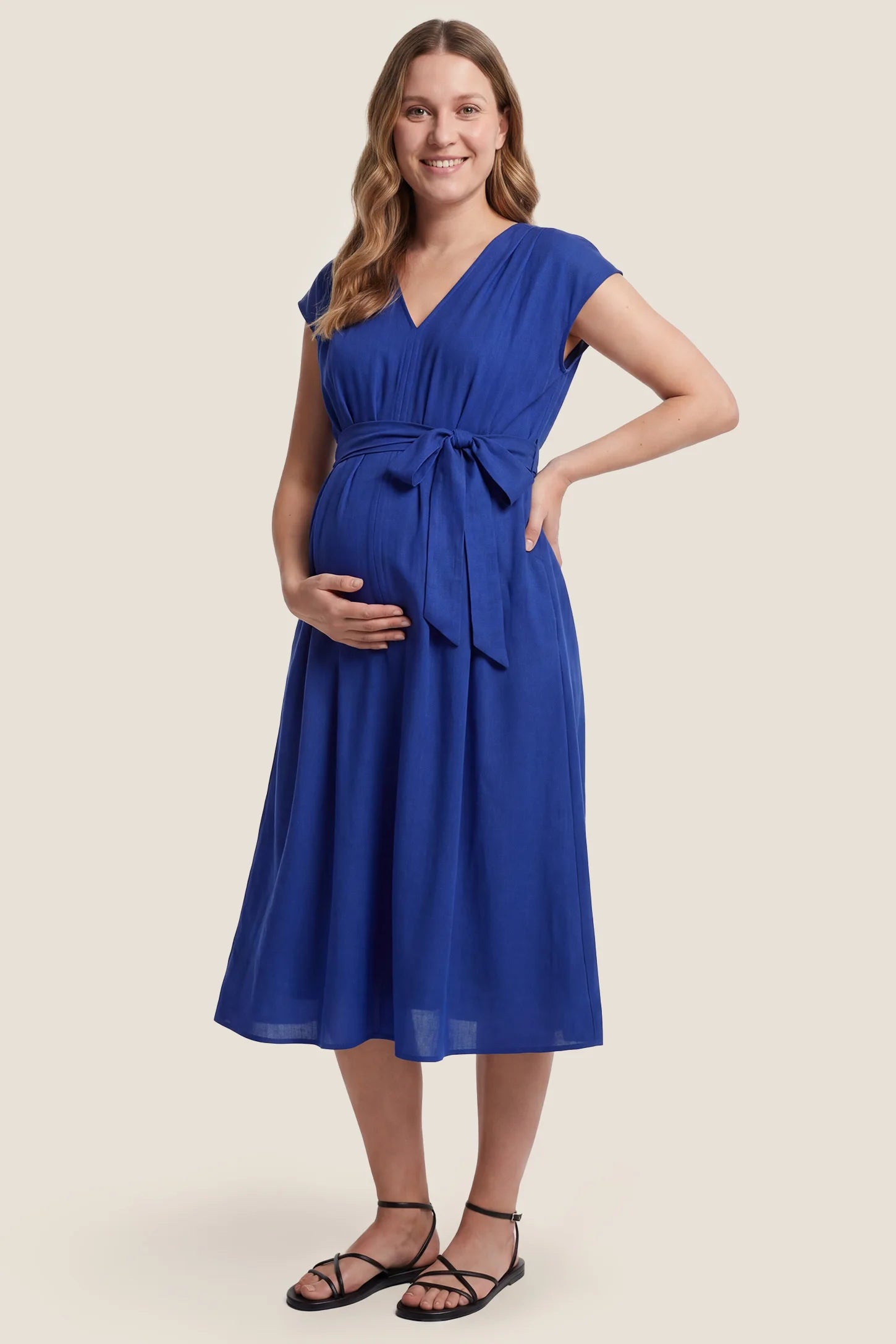 Cap Sleeves Belted Maternity Midi Dress Cap Sleeves Belted Midi Dress in Blue featuring a tie waist on a pregnant model, front view.