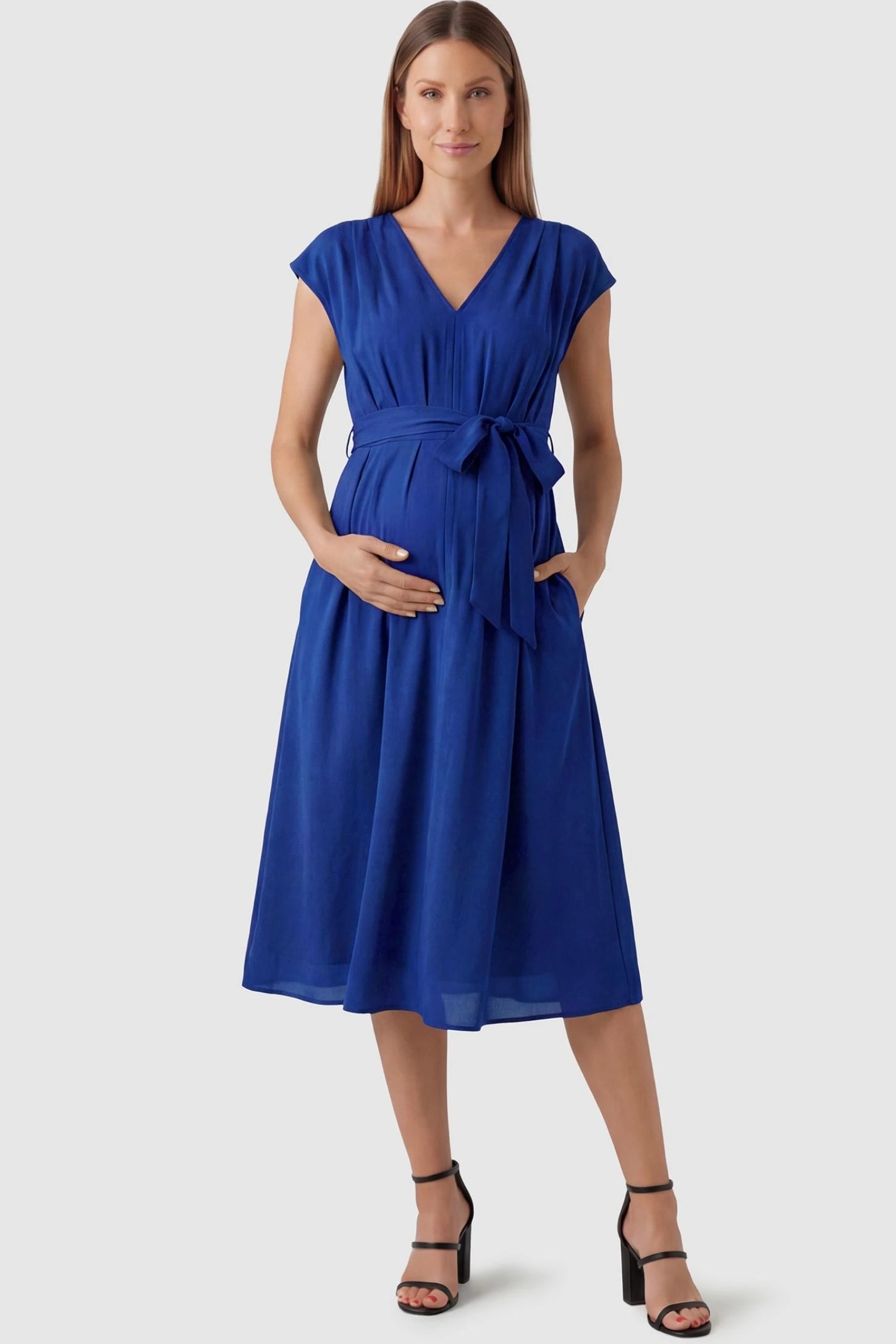 Cap Sleeves Belted Maternity Midi Dress Cap Sleeves Belted Midi Dress in Blue featuring a tie waist on a pregnant model, front view.