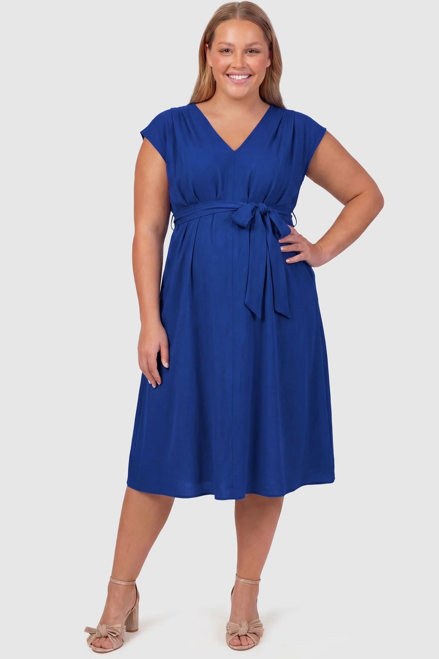 Cap Sleeves Belted Maternity Midi Dress Cap Sleeves Belted Midi Dress in Blue featuring a tie waist on a plus-size pregnant model, front view.
