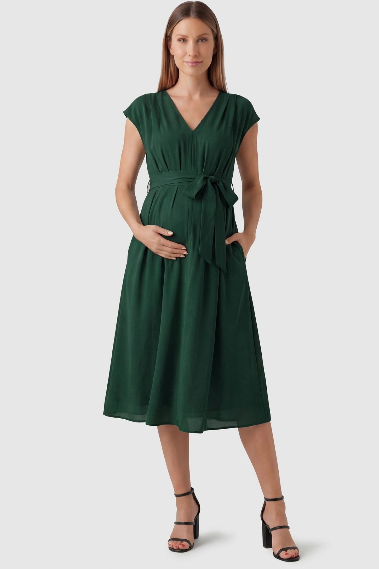 Cap Sleeves Belted Maternity Midi Dress Cap Sleeves Belted Midi Dress in Dark Green featuring a tie waist on a pregnant model, front view.