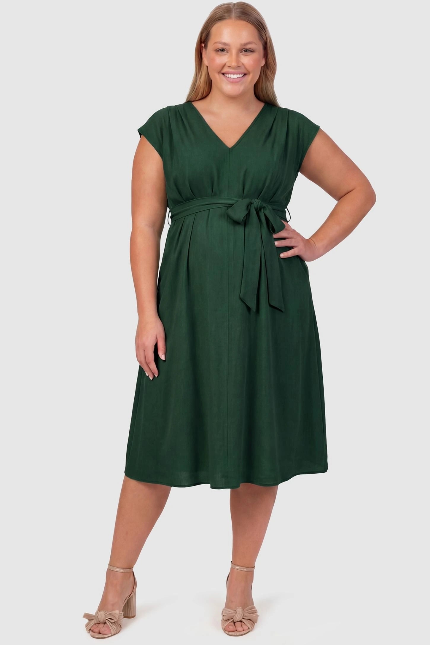 Cap Sleeves Belted Maternity Midi Dress Cap Sleeves Belted Midi Dress in Dark Green featuring a tie waist on a plus-size pregnant model, front view.