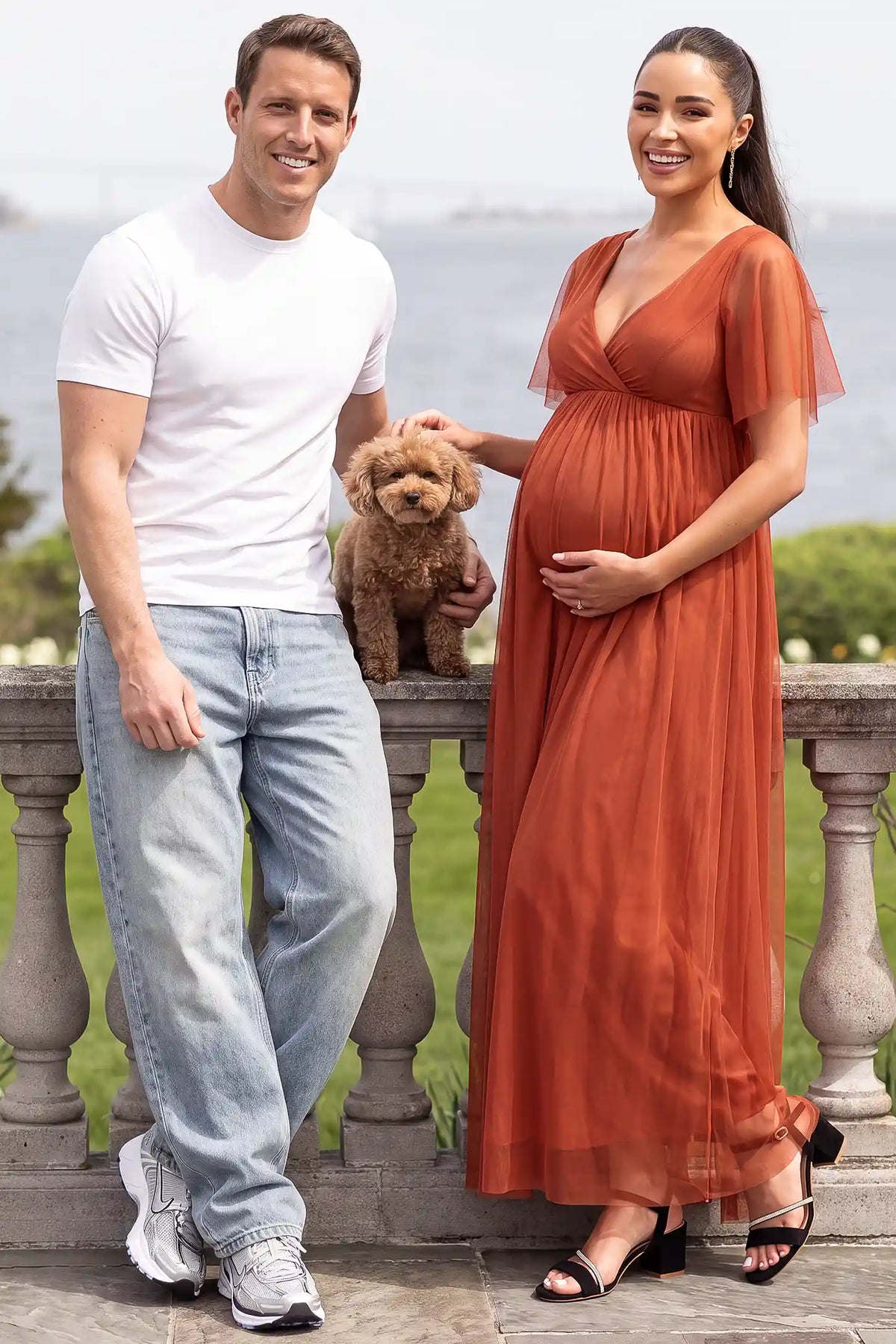 Chiffon Flutter Sleeve V-Neck Maternity Maxi Dress Chiffon Flutter Sleeve V-Neck Maternity Maxi Dress in Rust featuring flutter sleeves on a pregnant model, lifestyle front view.