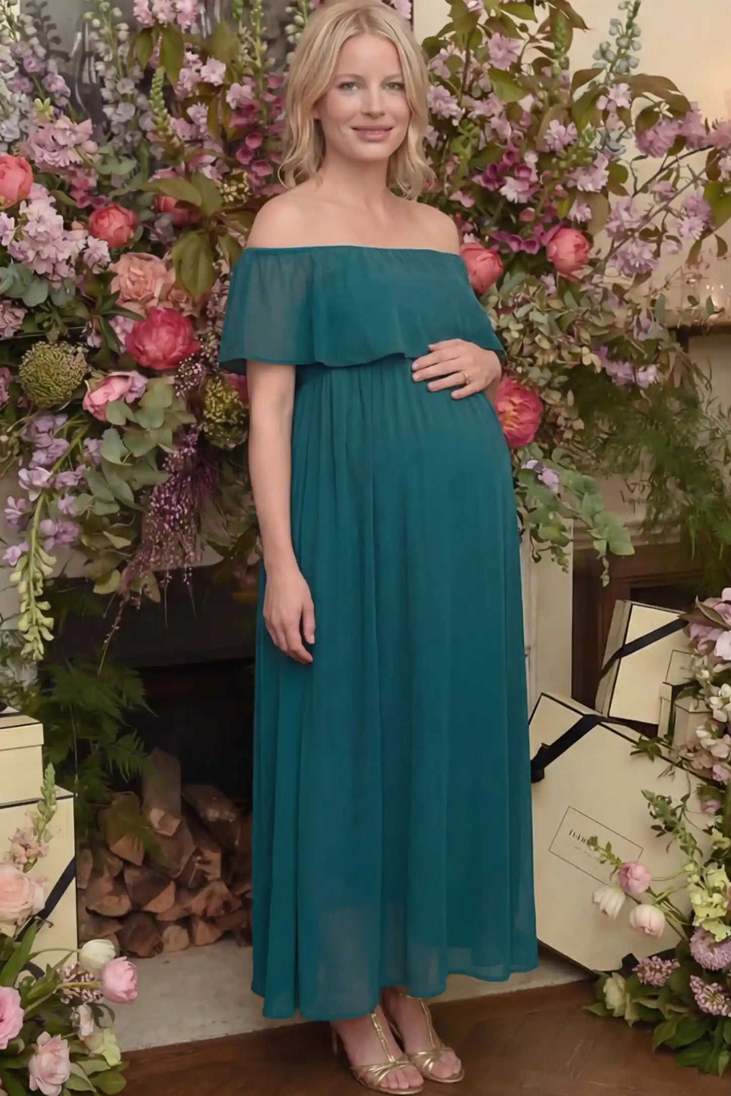 Chiffon Off Shoulder Maternity Maxi Dress Chiffon Off-Shoulder Maternity Maxi Dress in green featuring a Floor-length on a pregnant woman showing front.
