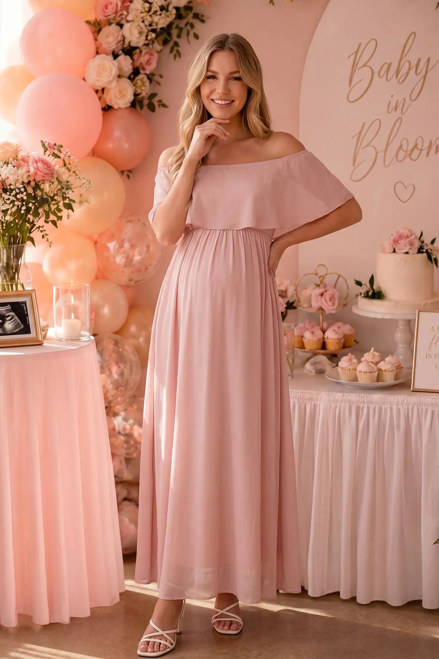 Chiffon Off-Shoulder Maternity Maxi Dress in Pink featuring a Floor-length on a pregnant woman showing side.