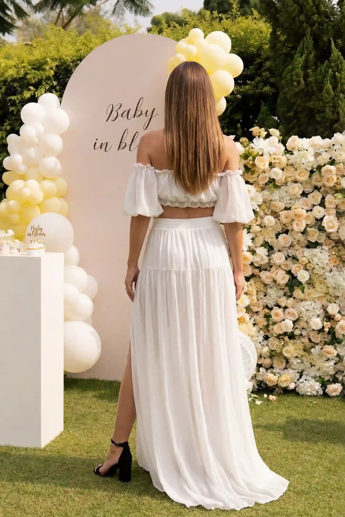 Chiffon Ruffle Off-Shoulder Two-Piece Maxi Maternity Dress Chiffon Ruffle Off-Shoulder Two-Piece Maxi Maternity Dress in White featuring a cropped tiered top on a pregnant model, back view.