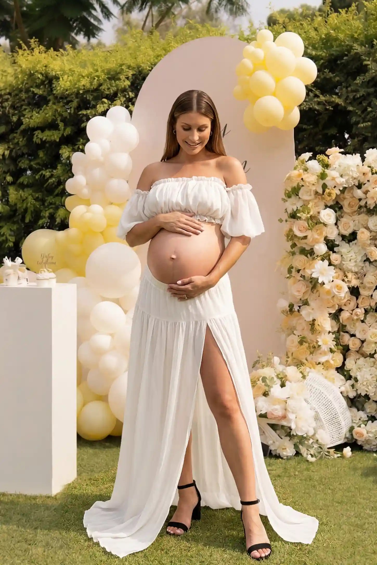 Chiffon Ruffle Off-Shoulder Two-Piece Maxi Maternity Dress Chiffon Ruffle Off-Shoulder Two-Piece Maxi Maternity Dress in White featuring a ruffled off-shoulder neckline on a pregnant model, front view.