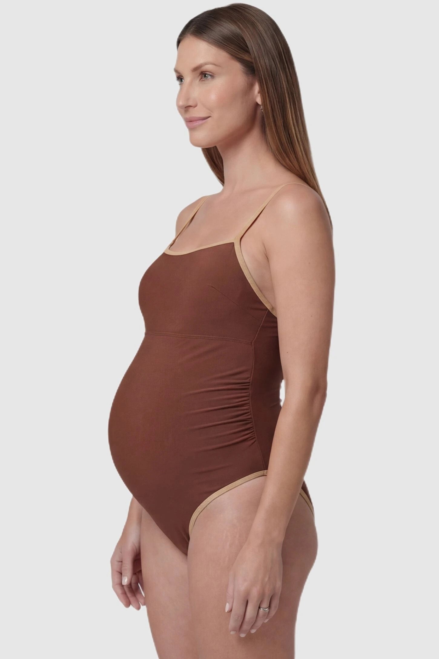 Contrast Trim Square Neck Maternity Swimsuit Contrast Trim Square Neck Maternity Swimsuit in Brown featuring beige trim and ruched sides, side view on pregnant model.