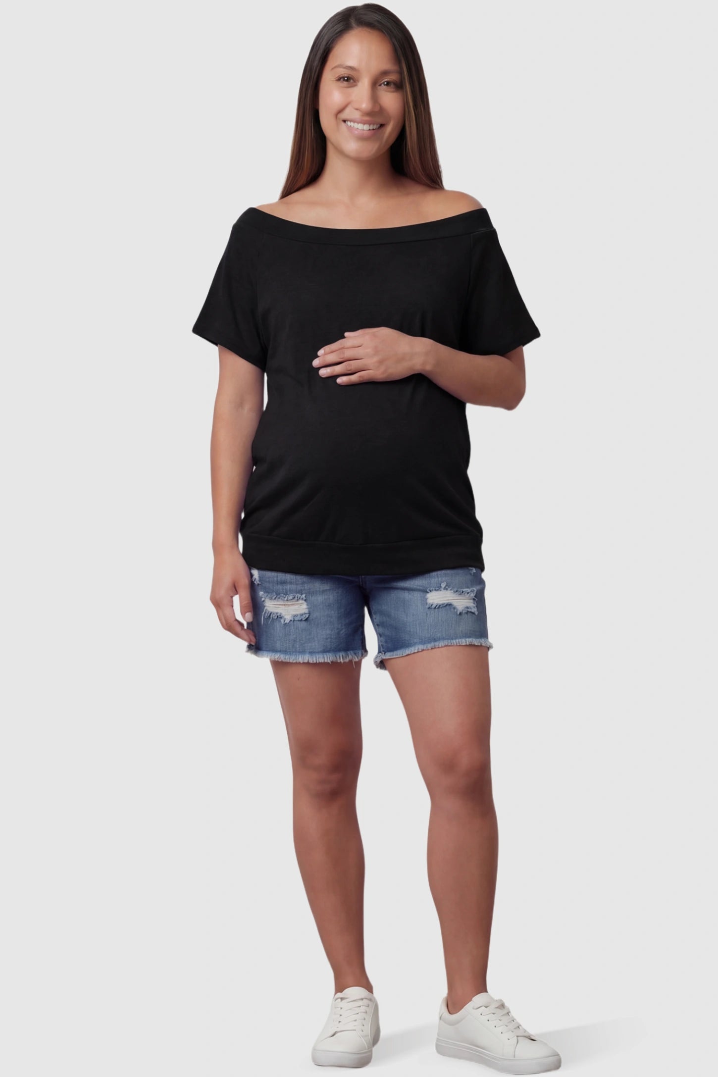 Convertible Neck Short Sleeve Maternity Top Convertible Neck Short Sleeve Maternity Top in black featuring an adjustable neckline and a comfortable banded hem on a pregnant model full body view.