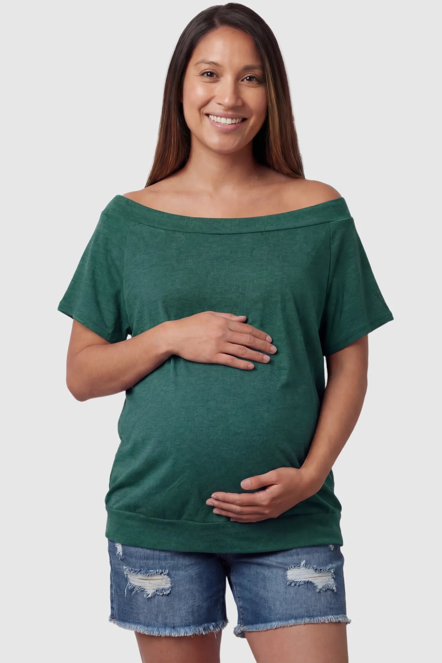 Convertible Neck Short Sleeve Maternity Top Convertible Neck Short Sleeve Maternity Top in green featuring an adjustable neckline and a comfortable banded hem on a pregnant model front view.