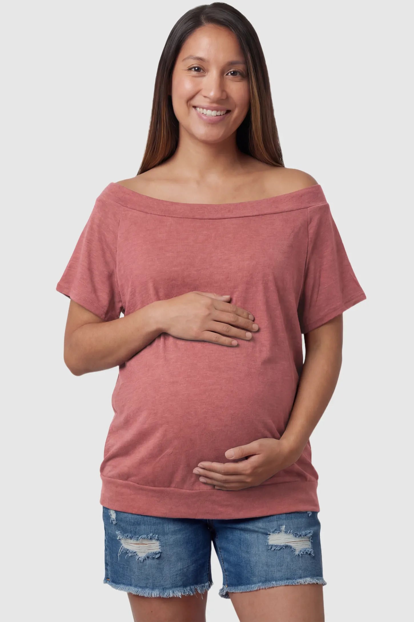 Convertible Neck Short Sleeve Maternity Top Convertible Neck Short Sleeve Maternity Top in pink featuring an adjustable neckline and a comfortable banded hem on a pregnant model front view.