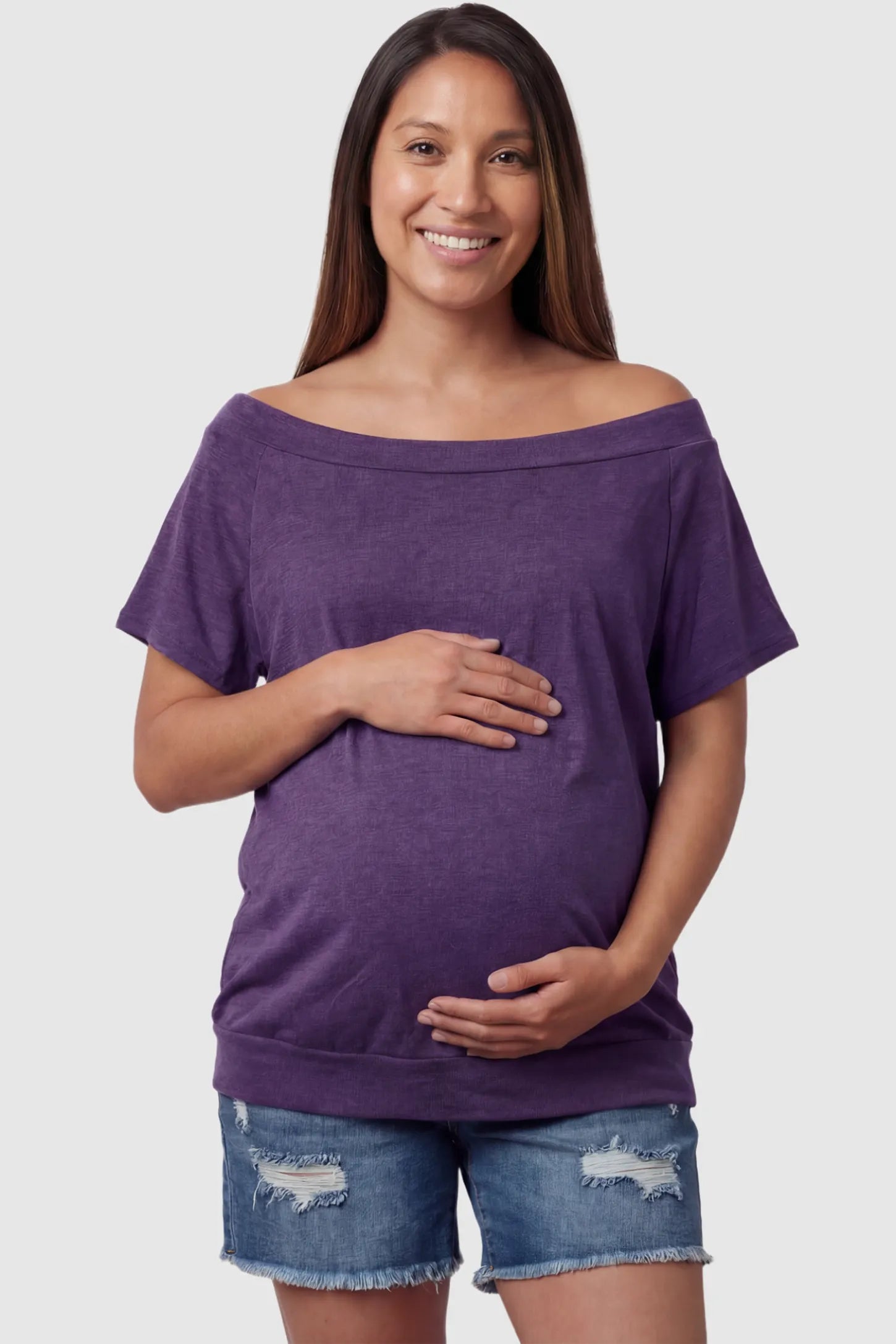 Convertible Neck Short Sleeve Maternity Top Convertible Neck Short Sleeve Maternity Top in purple featuring an adjustable neckline and a comfortable banded hem on a pregnant model front view.