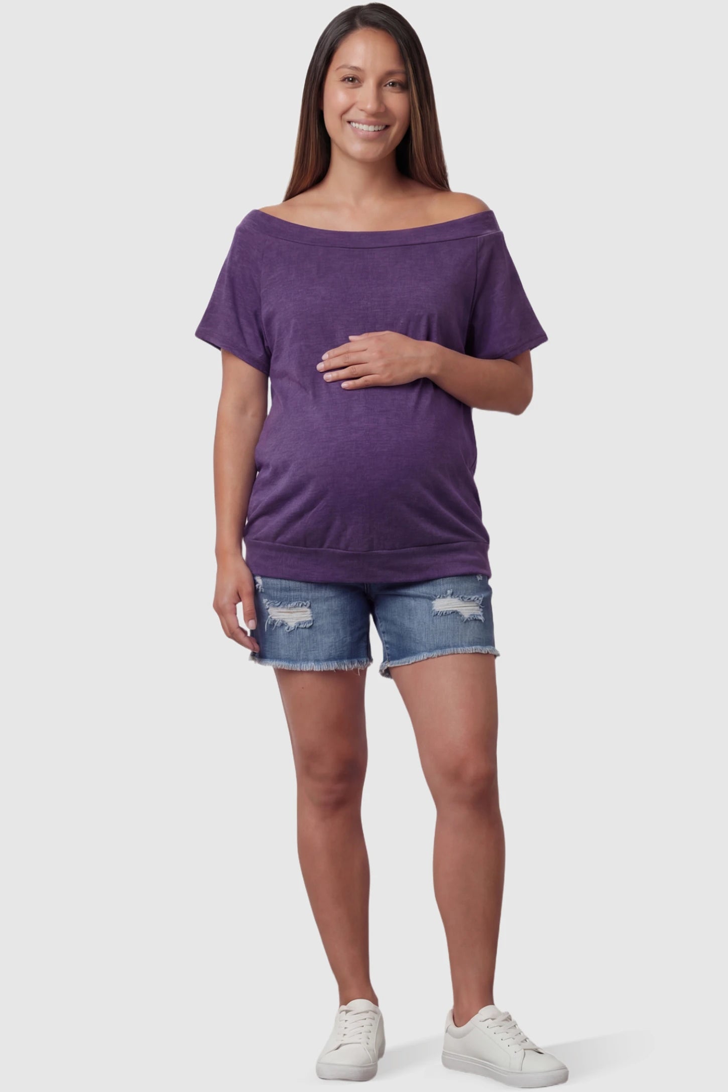 Convertible Neck Short Sleeve Maternity Top Convertible Neck Short Sleeve Maternity Top in purple featuring an adjustable neckline and a comfortable banded hem on a pregnant model full body view.