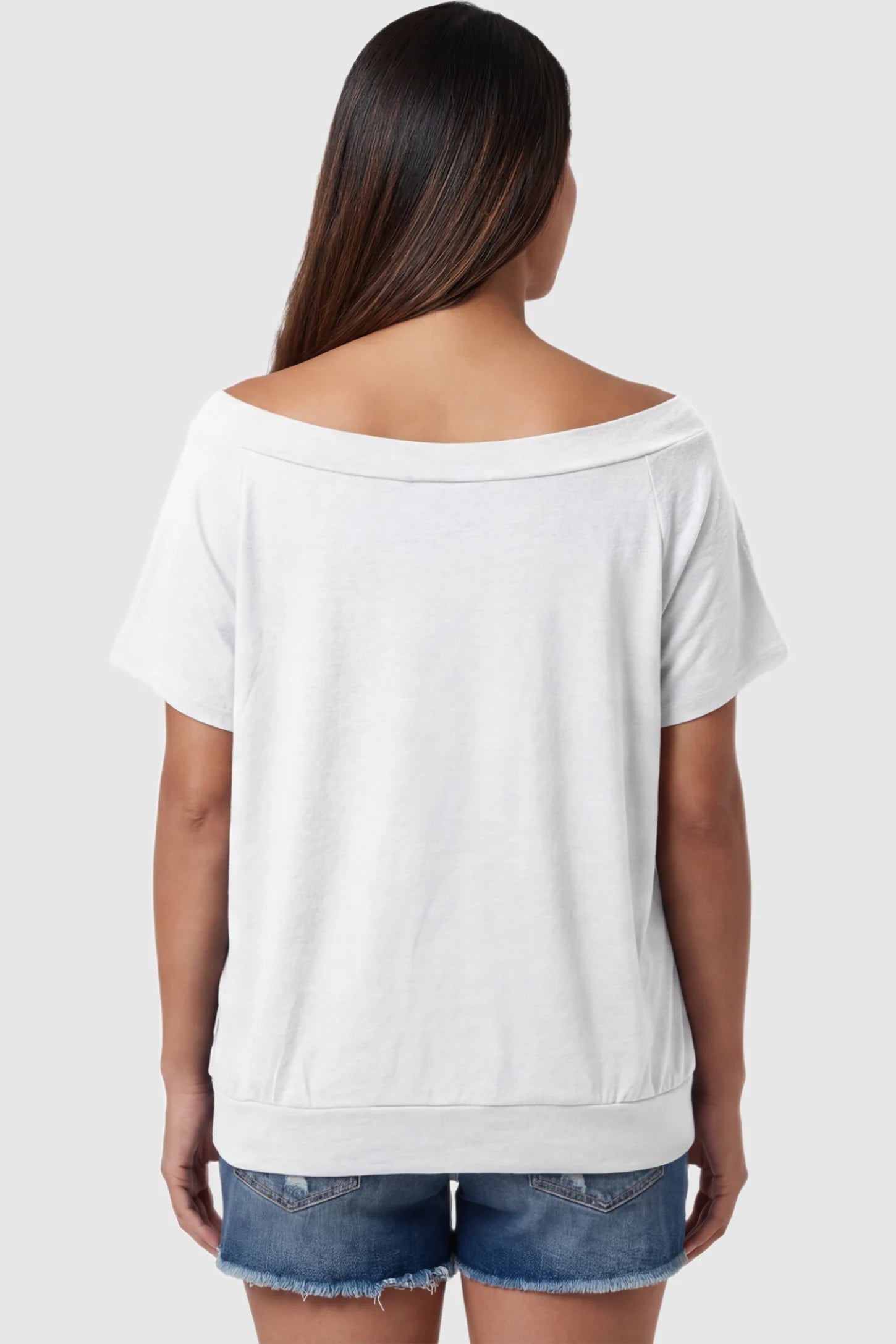 Convertible Neck Short Sleeve Maternity Top Convertible Neck Short Sleeve Maternity Top in white featuring wide off the shoulder neckline and a comfortable banded hem on a pregnant model back view.