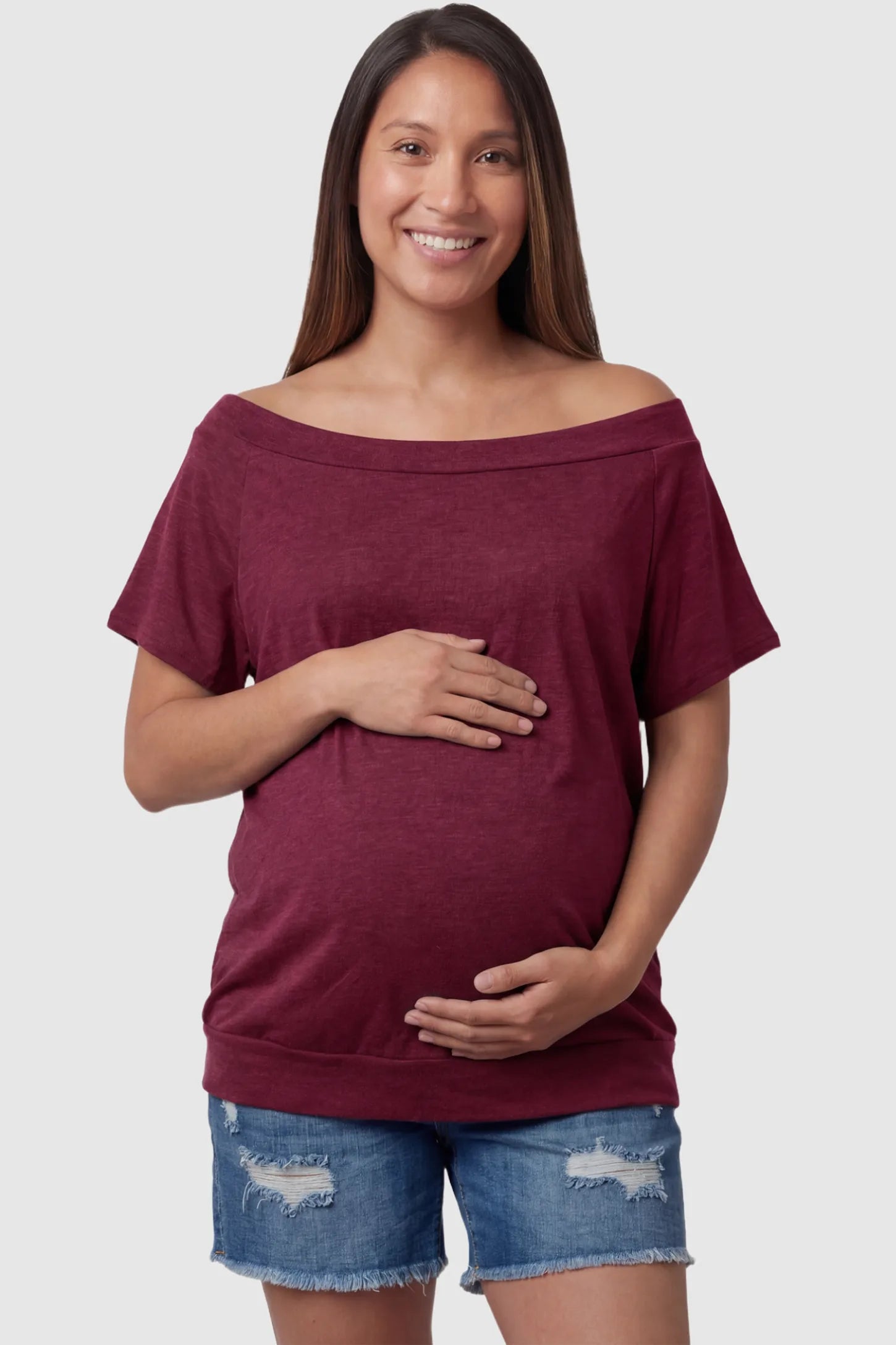 Convertible Neck Short Sleeve Maternity Top Convertible Neck Short Sleeve Maternity Top in wine red featuring an adjustable neckline and a comfortable banded hem on a pregnant model front view.