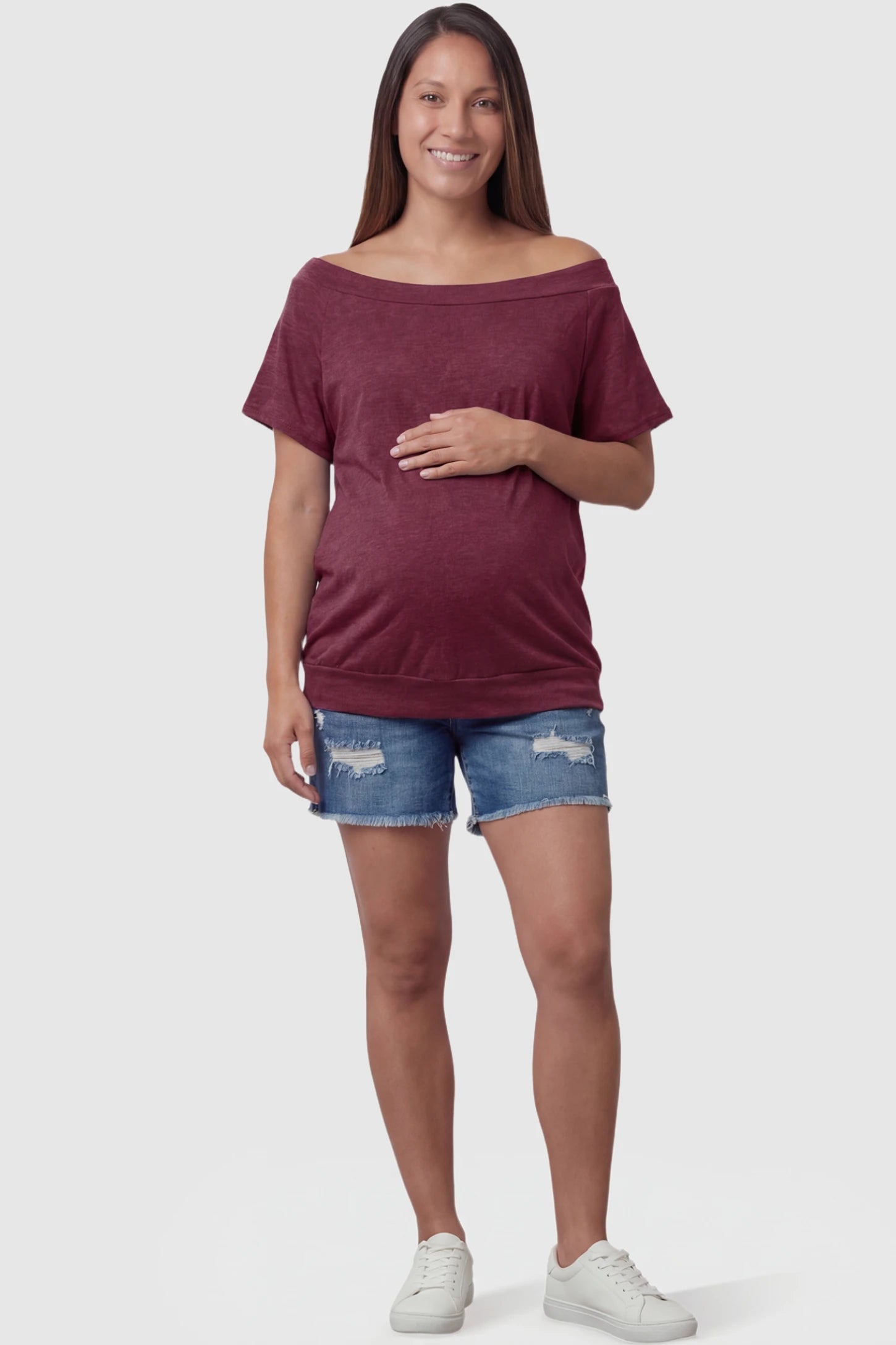 Convertible Neck Short Sleeve Maternity Top Convertible Neck Short Sleeve Maternity Top in wine red featuring an adjustable neckline and a comfortable banded hem on a pregnant model full body view.