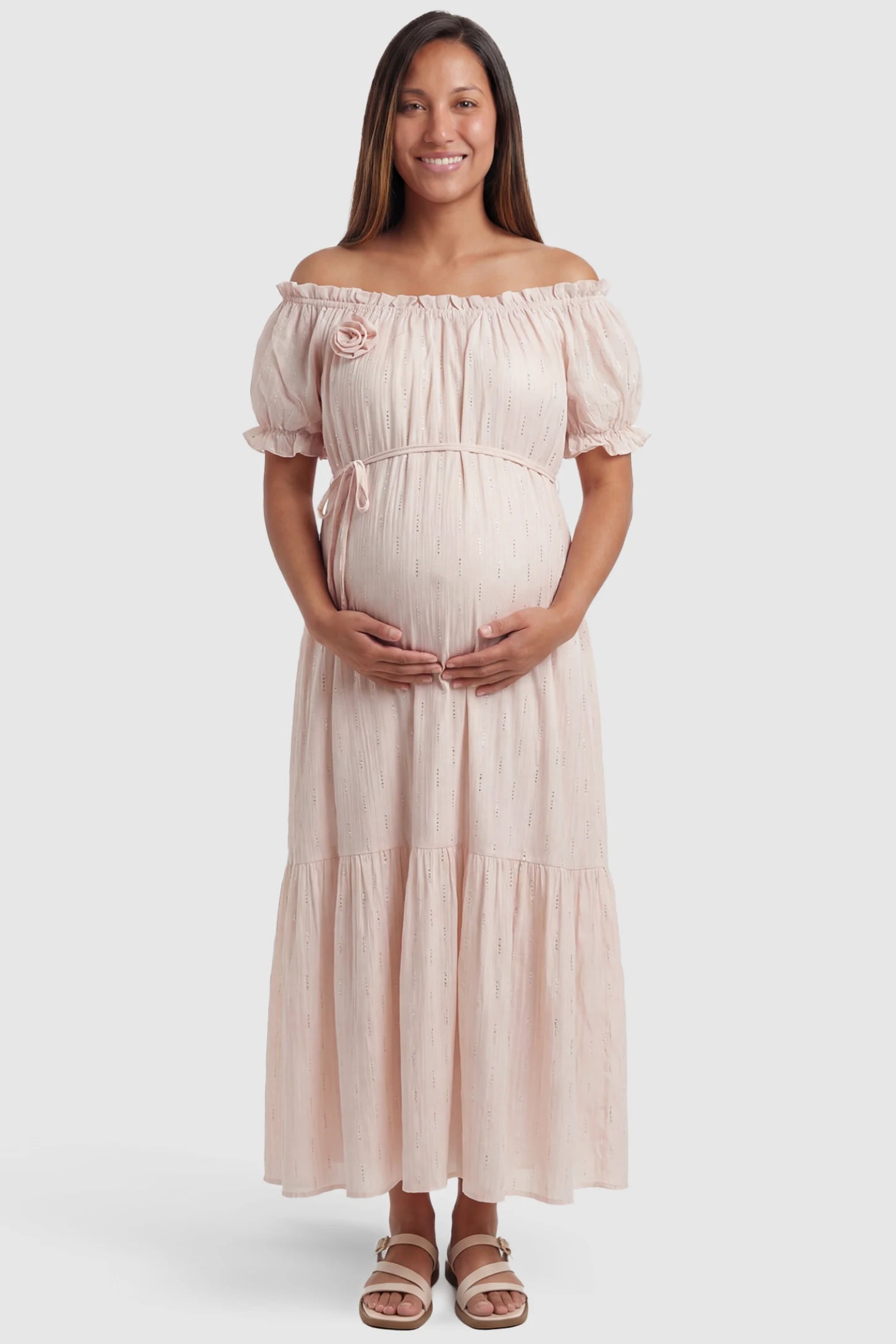 Convertible Neck Tiered Maternity Midi Dress Convertible Neck Tiered Maternity Midi Dress in Pink featuring elastic waist tie, short sleeves on a pregnant model, front view.