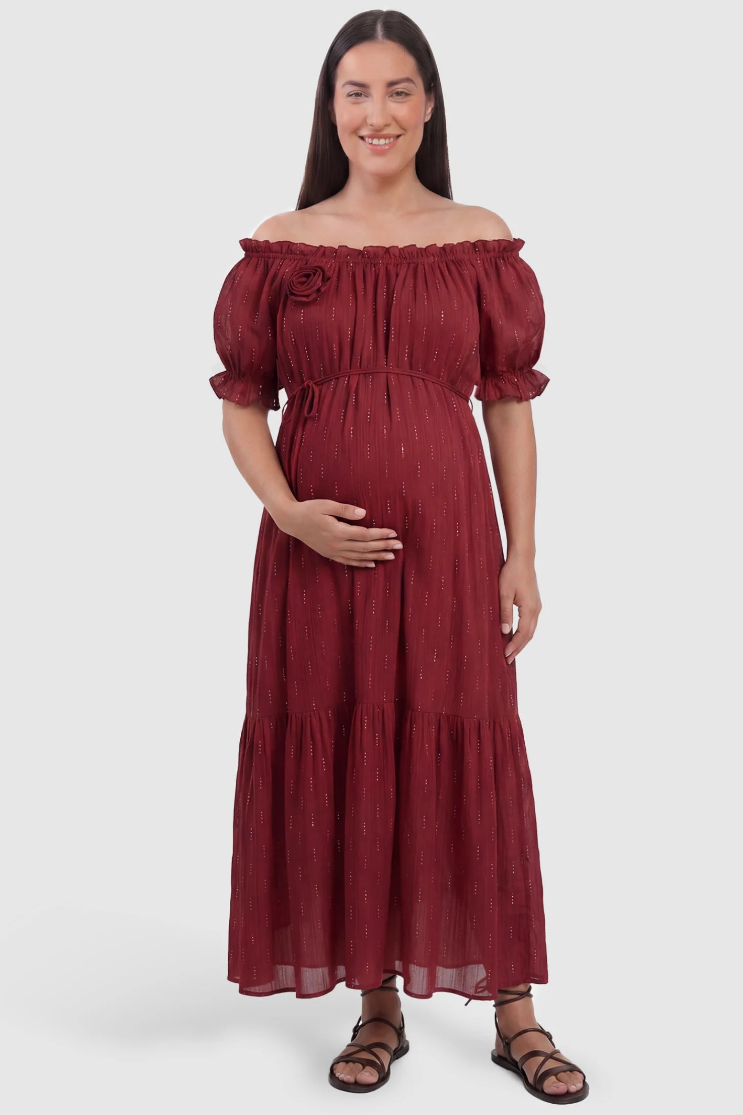 Convertible Neck Tiered Maternity Midi Dress Convertible Neck Tiered Maternity Midi Dress in Red featuring elastic waist tie, short sleeves on a plus size pregnant model, front view.