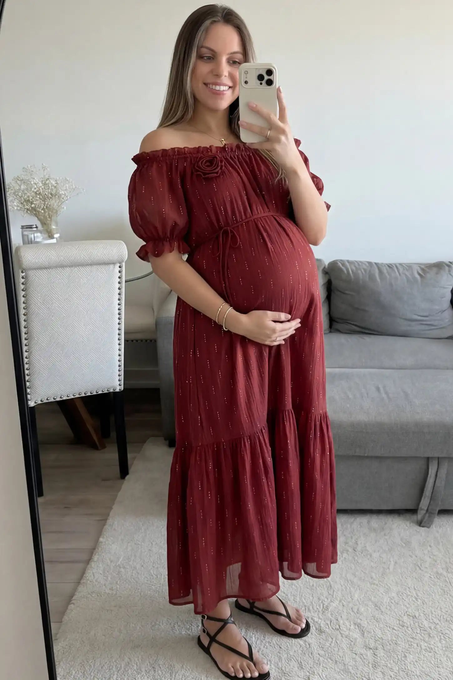 Convertible Neck Tiered Maternity Midi Dress Convertible Neck Tiered Maternity Midi Dress in Red featuring elastic waist tie, short sleeves on a pregnant woman in indoor setting, front view.
