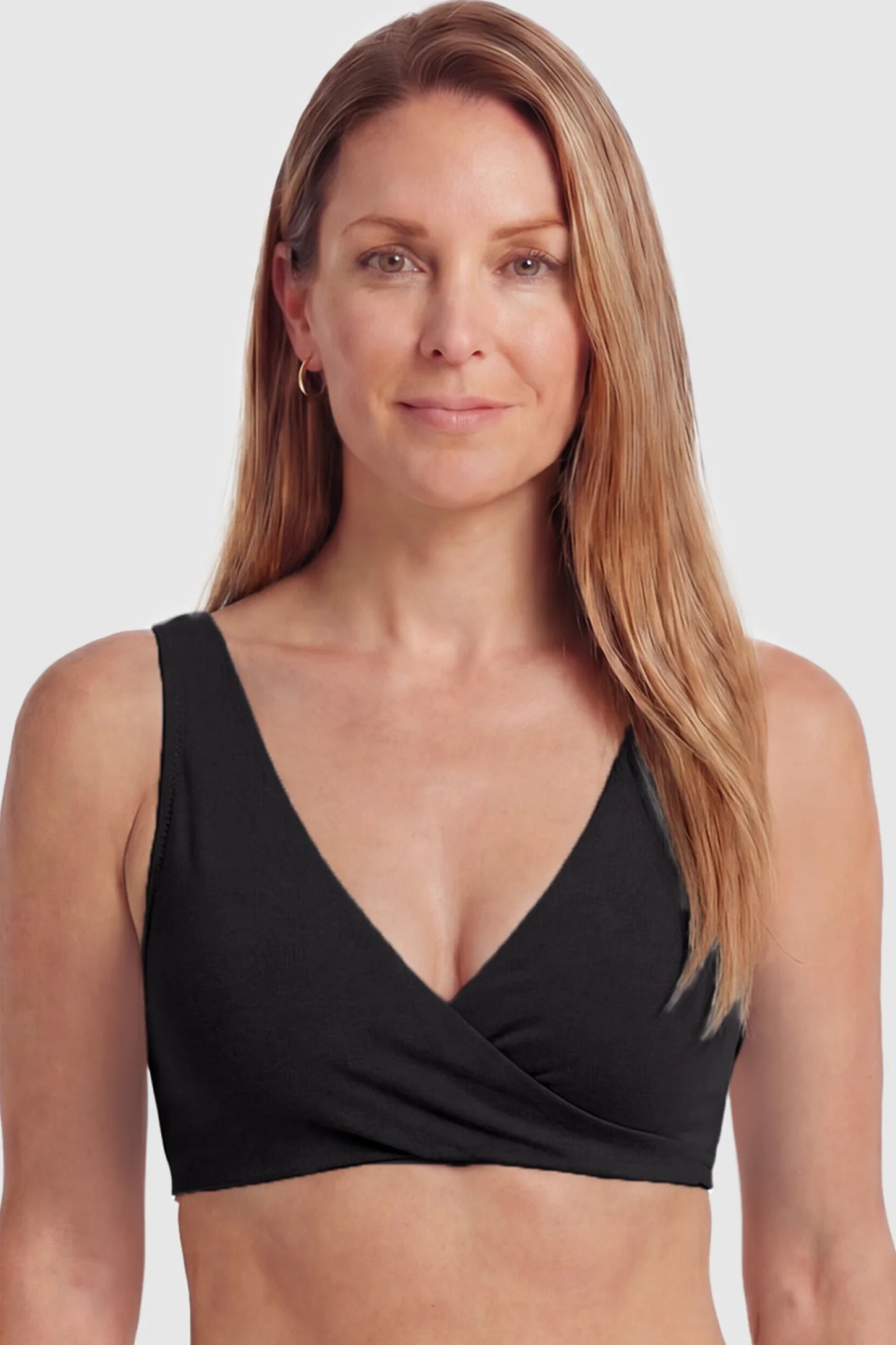 Cotton Blend Crossover Maternity Nursing Bra Cotton Blend Crossover Maternity Nursing Bra in Black featuring a wire-free wrap front on a postpartum model showing front.