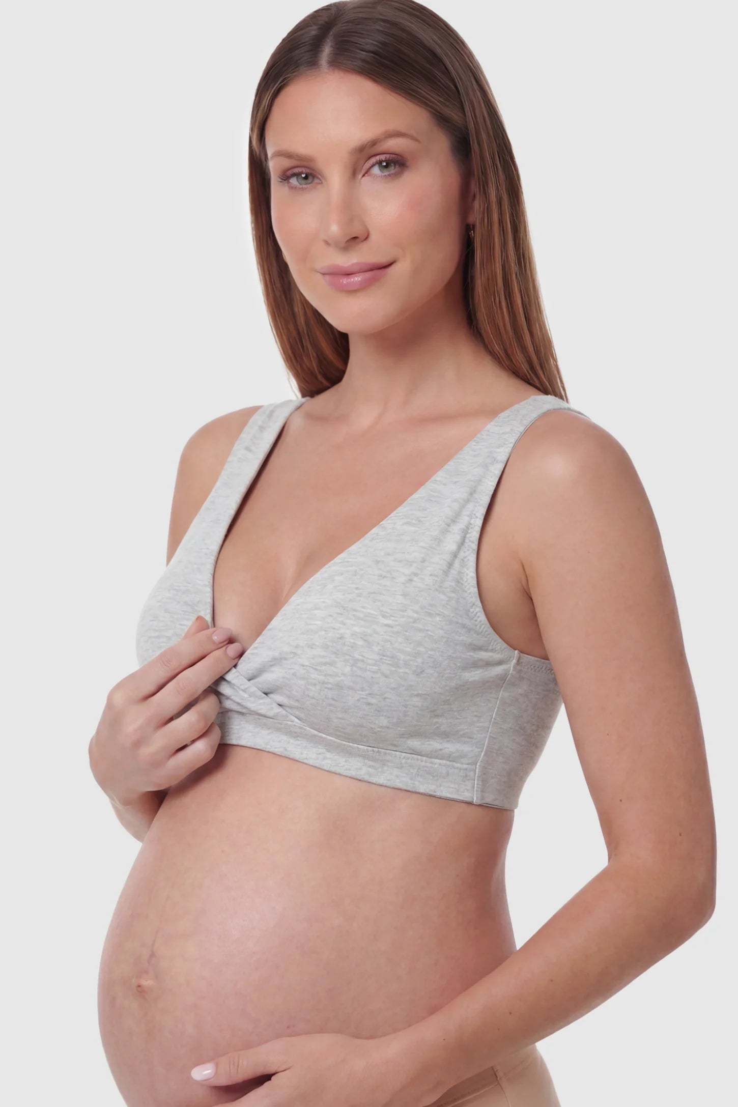 Cotton Blend Crossover Maternity Nursing Bra Cotton Blend Crossover Maternity Nursing Bra in Light Gray featuring a wire-free wrap front on a pregnant model showing detail.