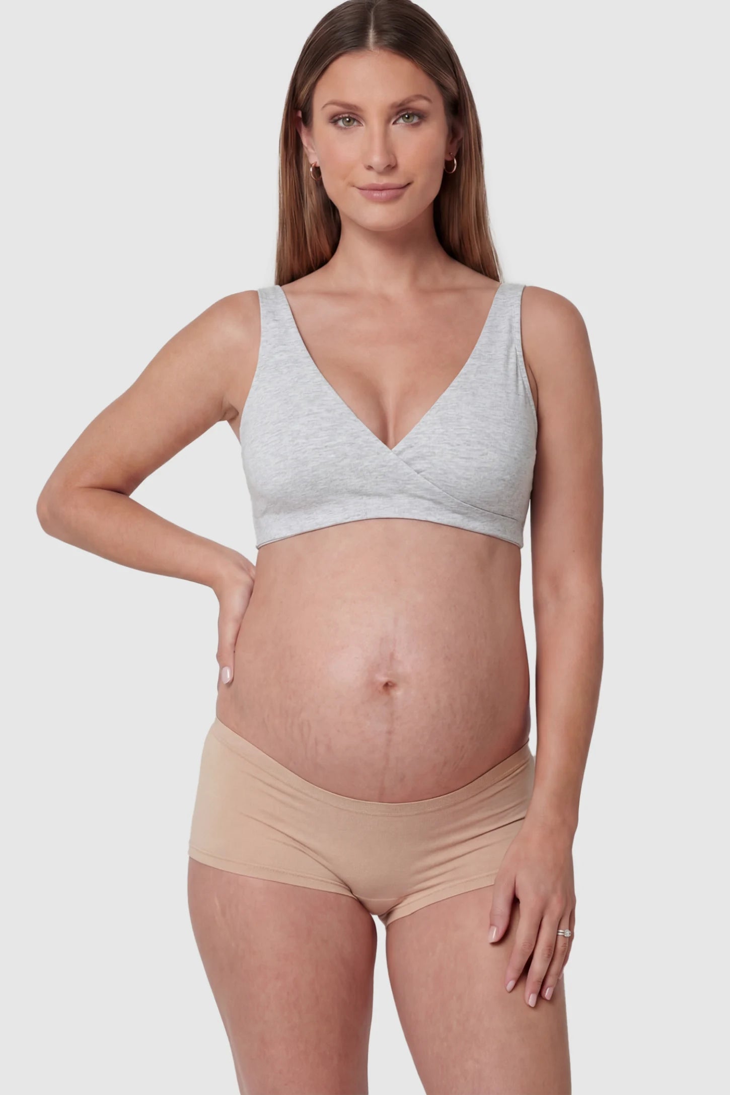 Cotton Blend Crossover Maternity Nursing Bra Cotton Blend Crossover Maternity Nursing Bra in Light Gray featuring a wire-free wrap front on a pregnant model showing front.
