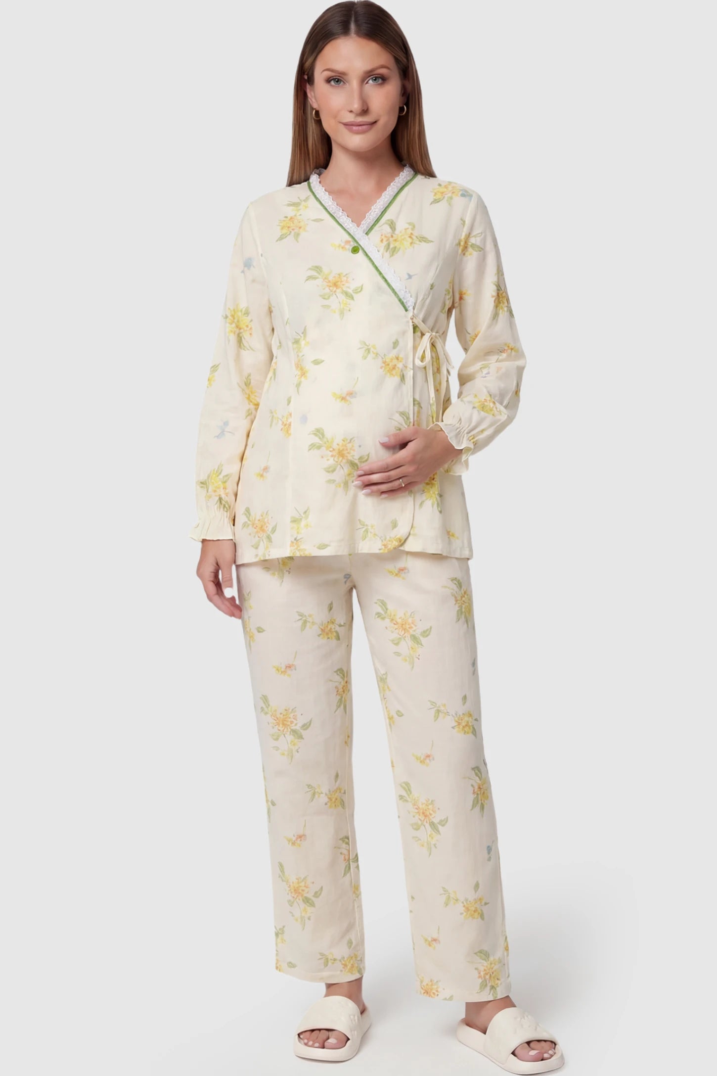 Cotton Long Sleeve Top & Pants Maternity Pajama Set Cotton Long Sleeve Maternity Pajama Set in Osmanthus Floral Print featuring a wrap-style top and lace trim on a pregnant model showing front.