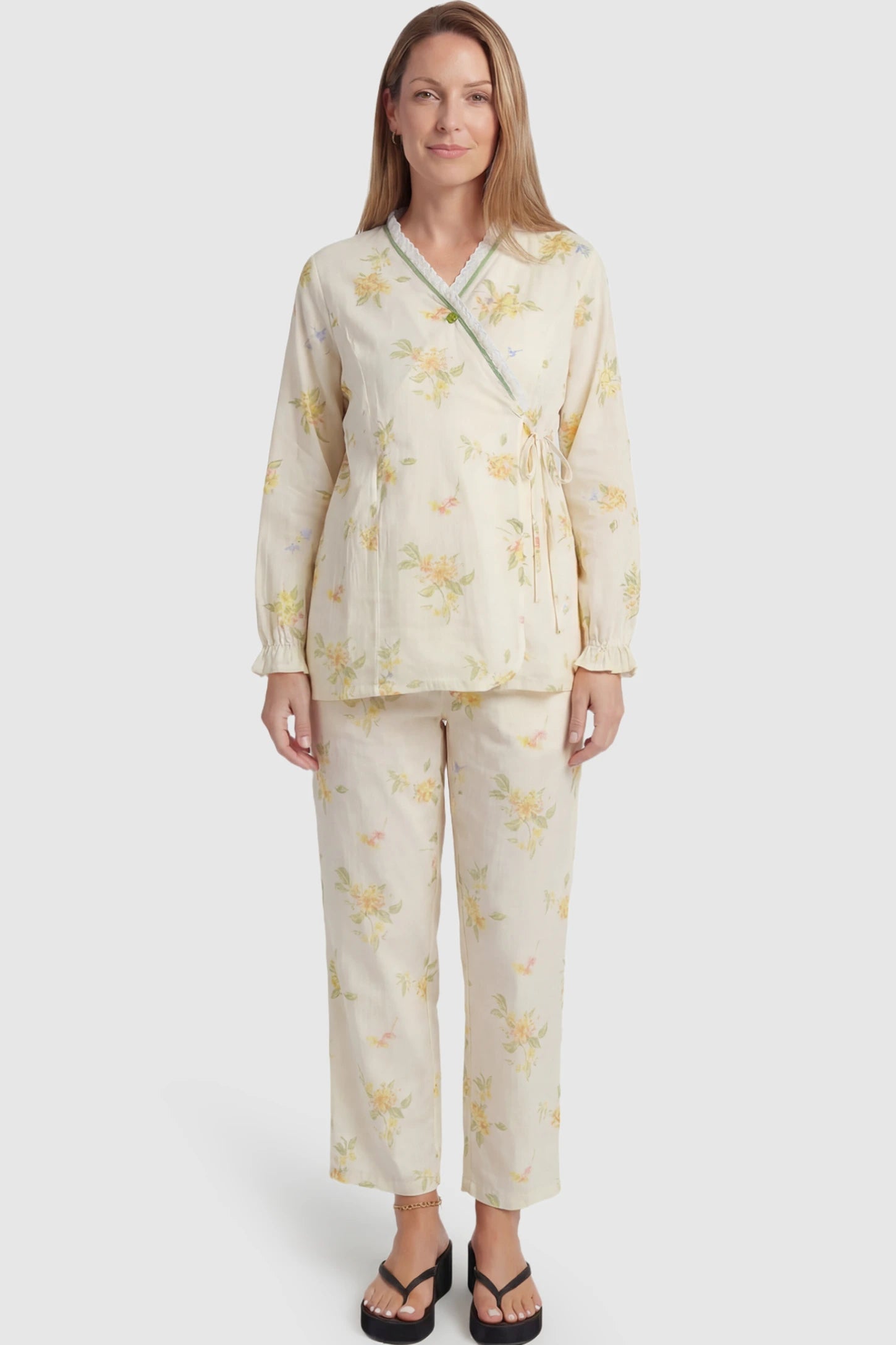 Cotton Long Sleeve Top & Pants Maternity Pajama Set Cotton Long Sleeve Maternity Pajama Set in Osmanthus Floral Print featuring a wrap-style top and lace trim on a postpartum model showing front.