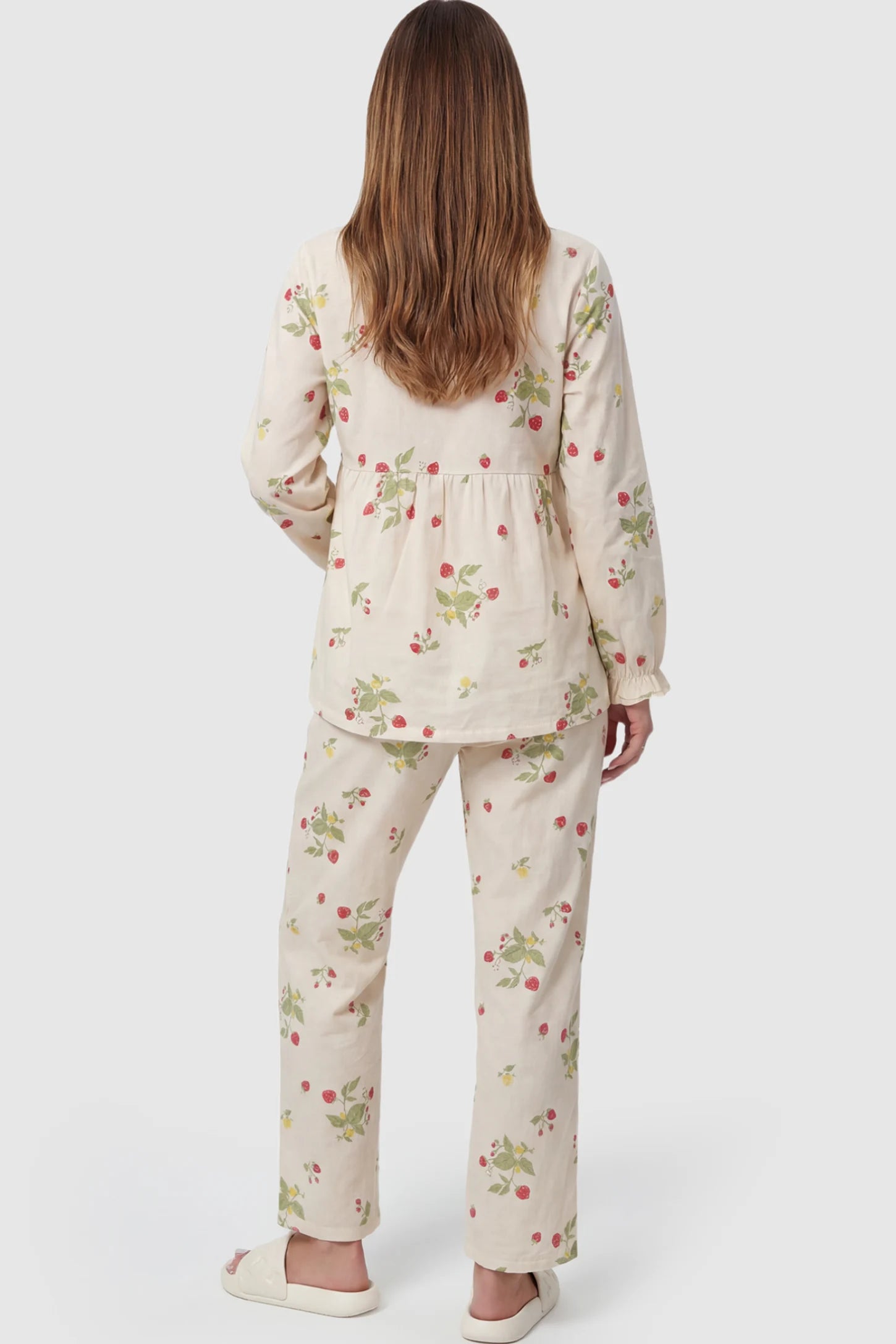 Cotton Long Sleeve Top & Pants Maternity Pajama Set Cotton Long Sleeve Maternity Pajama Set in Strawberry Cream Print featuring a wrap-style top and lace trim on a pregnant model showing front.